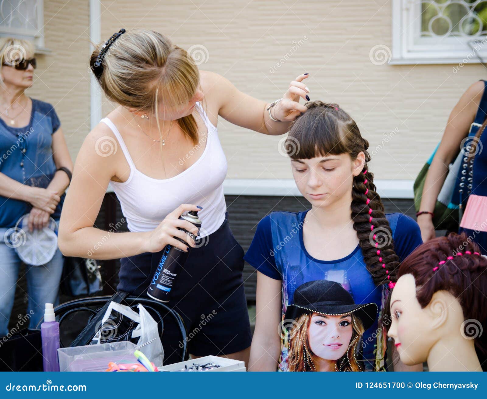 Woman Hairdresser Does a Hairstyle for a Girl at a City Party Editorial  Image - Image of long, hairdresser: 124651700