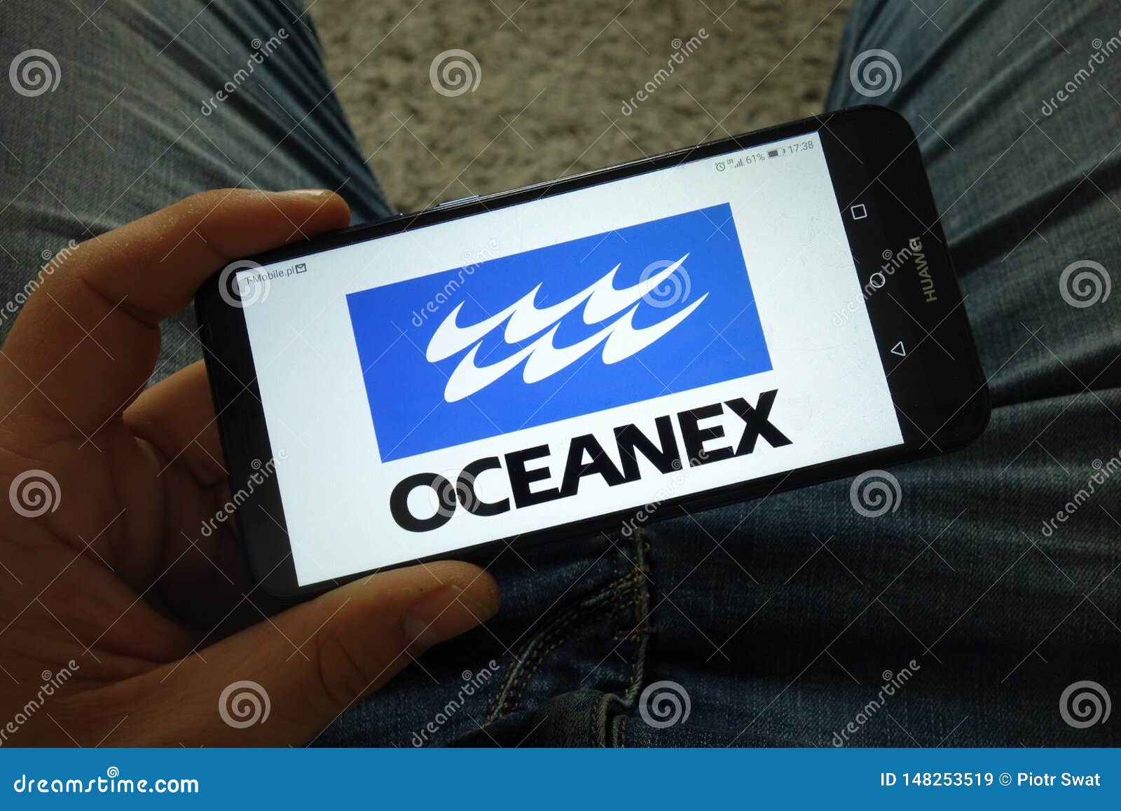 Man Holding Smartphone With Oceanex Cryptocurrency ...