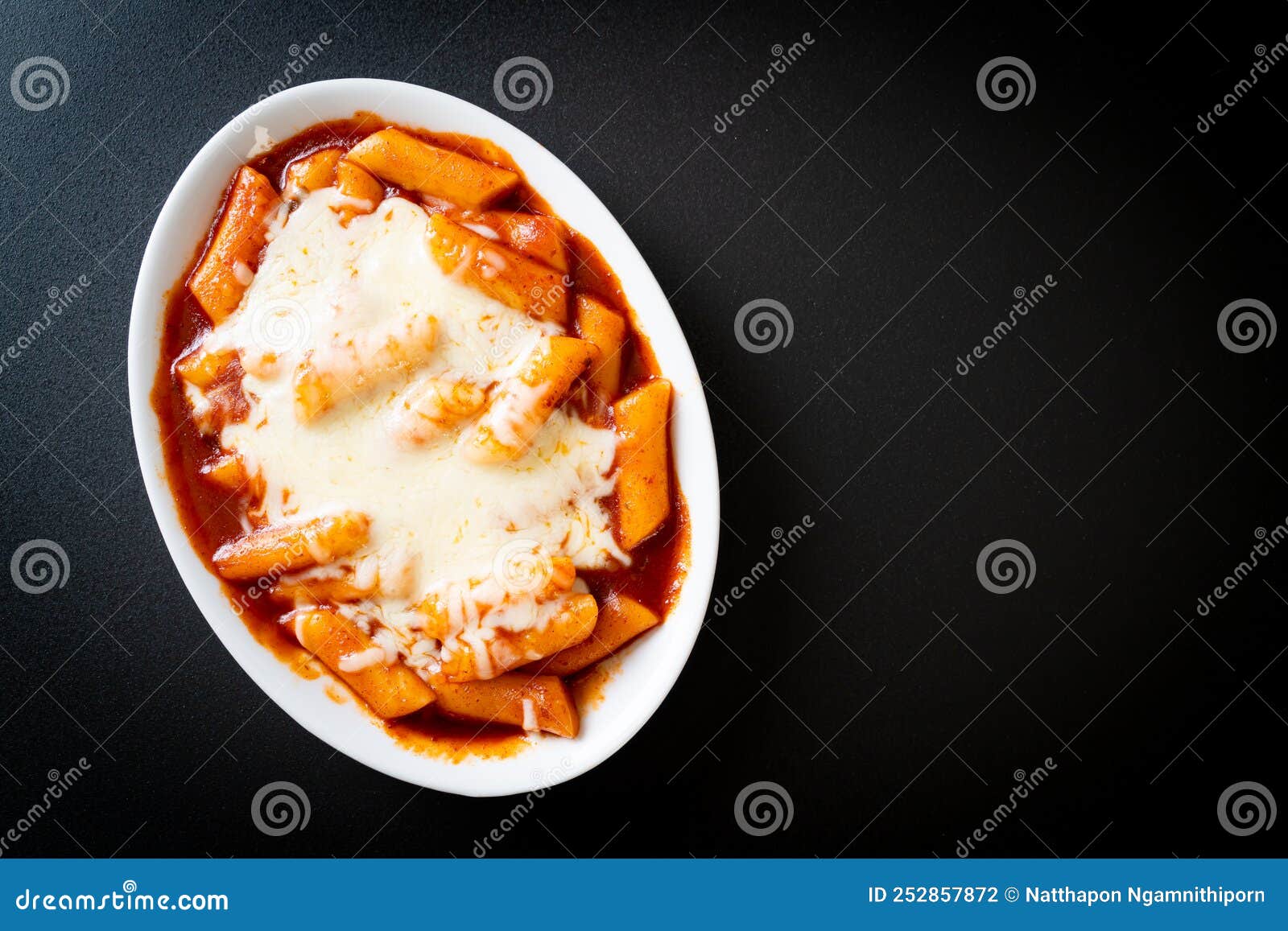 Korean rice cake in spicy Korean sauce with cheese, Cheese Tokpokki, Tteokbokki with Cheese - Korean food style