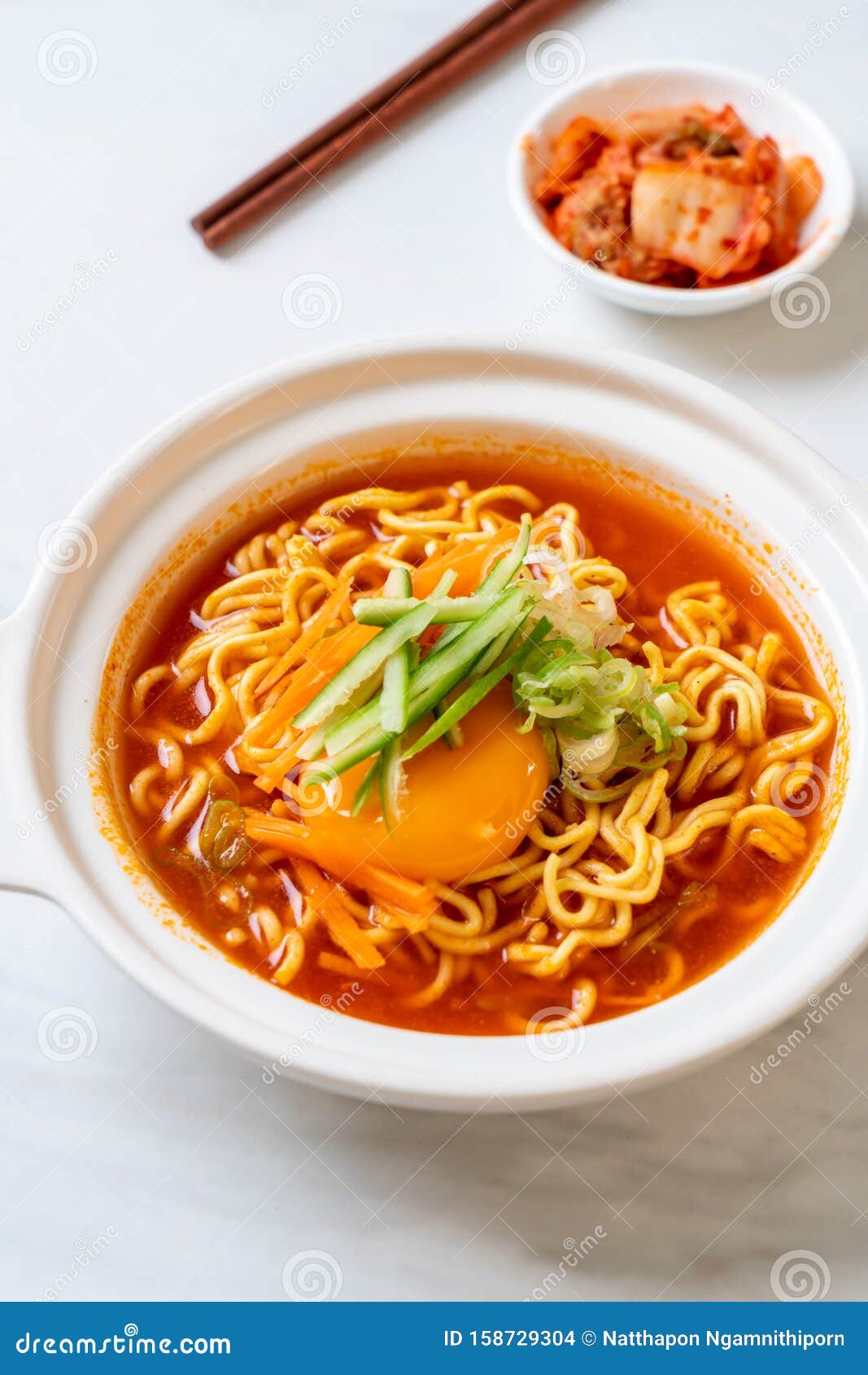 Korean Spicy Instant Noodles with Egg, Vegetable and Kimchi Stock Photo