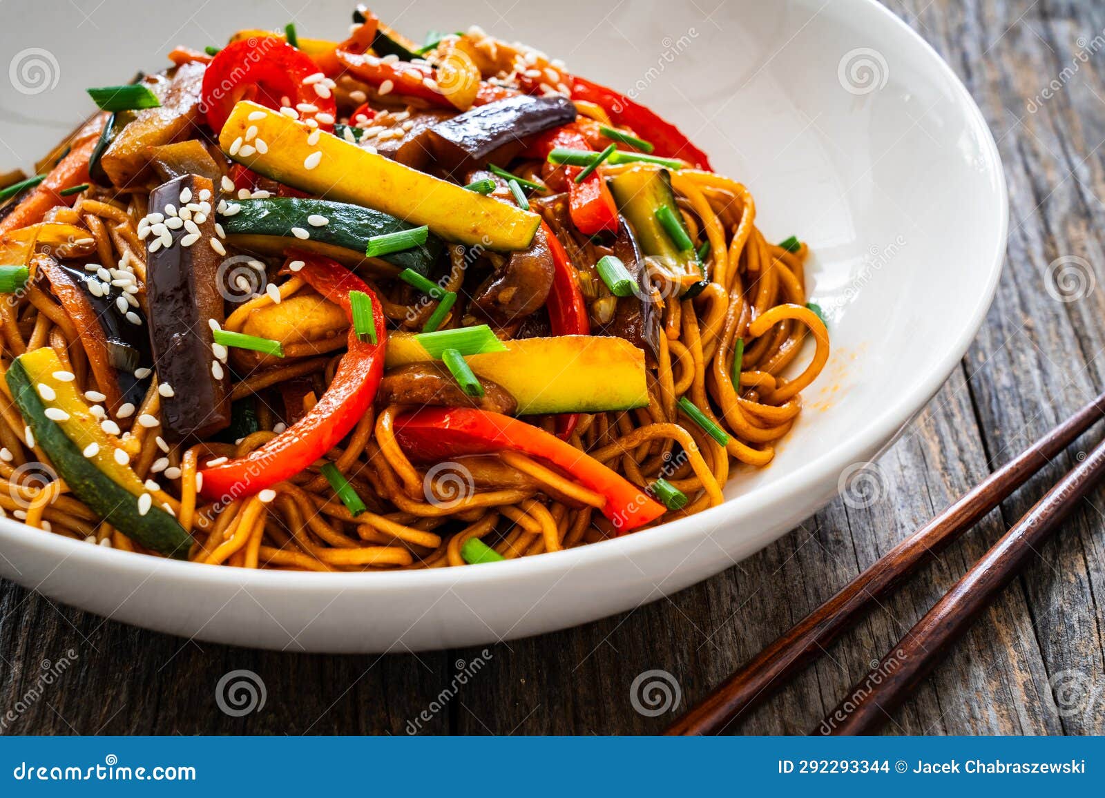 Korean Style Stir Fried Vegetables and Noodles on Wooden Table Stock