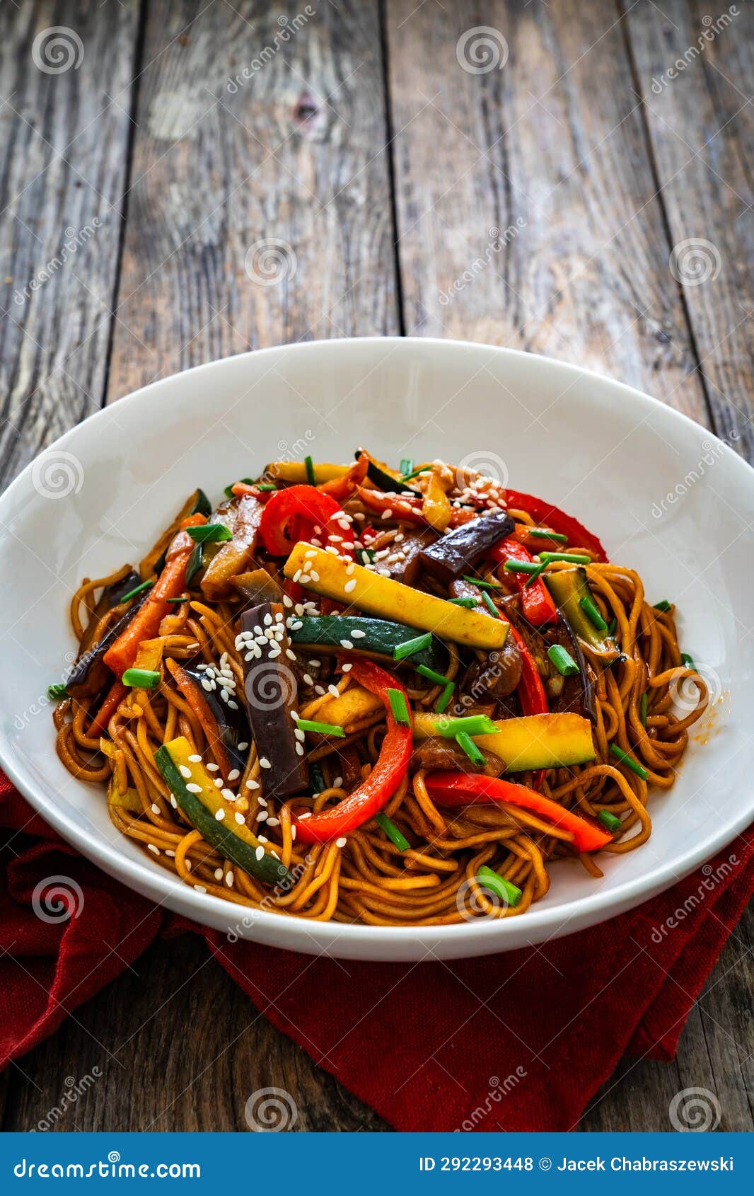 Korean Style Stir Fried Vegetables and Noodles on Wooden Table Stock
