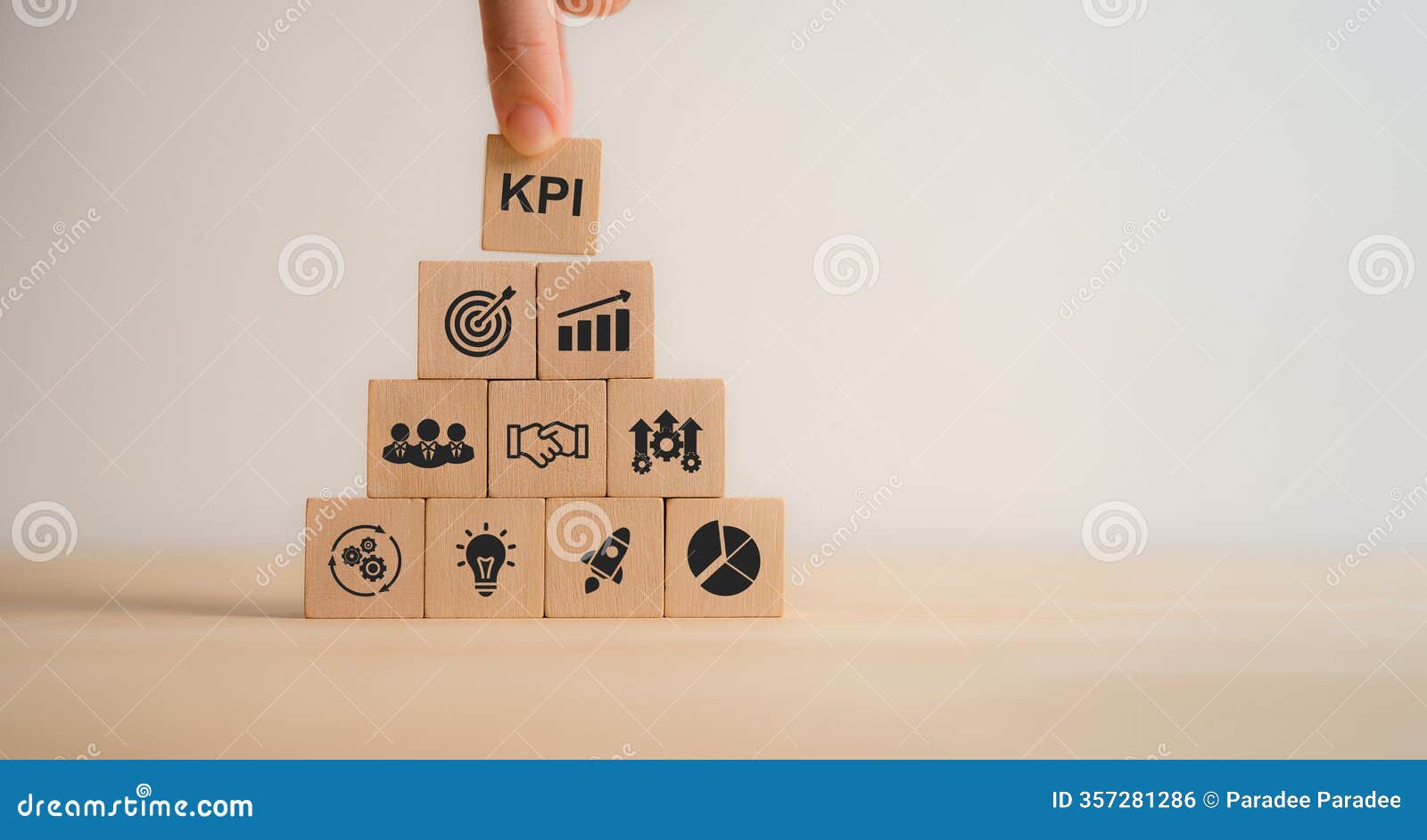 kpi concept. wooden blocks with kpi icons,copy space. key performance indicator using business intelligence metrics