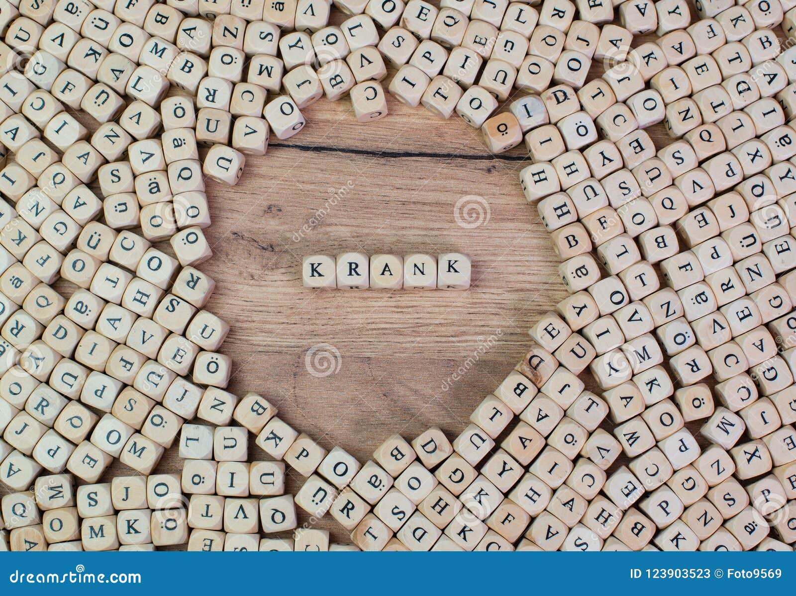 krank, german text for sick, word in letters on cube dices on table