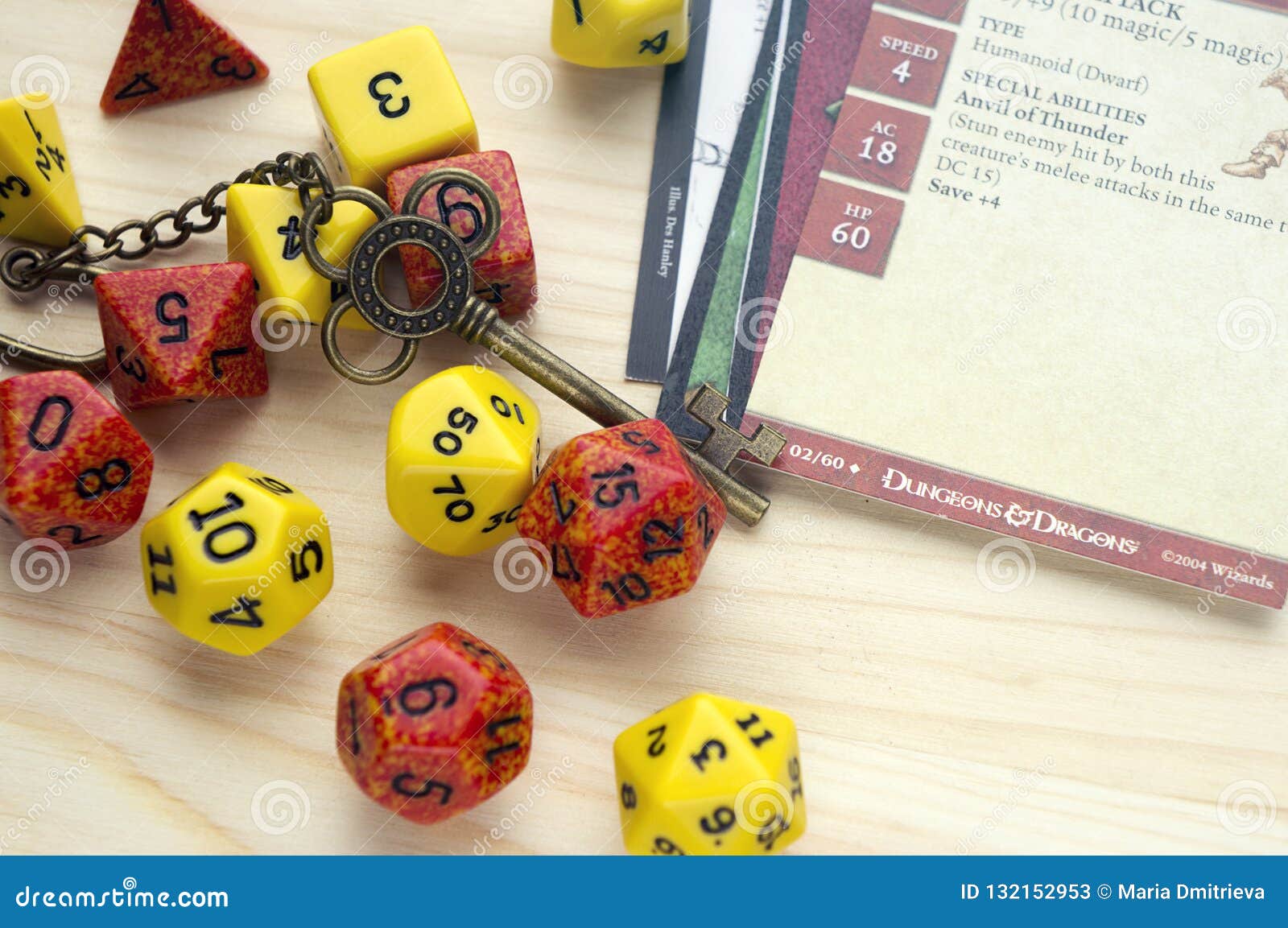 playing dungeons and dragons, a role play game. dices and cards lying on wooden surface. deco