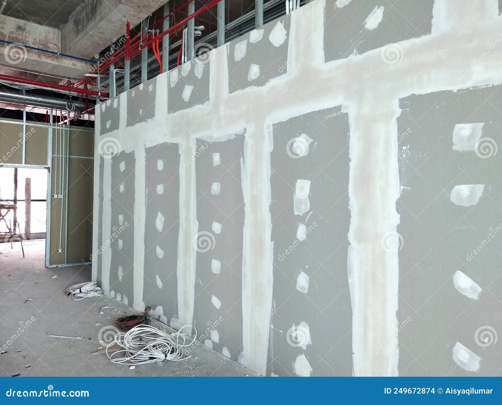 Drywall Installation Work in Progress by Construction Workers at the