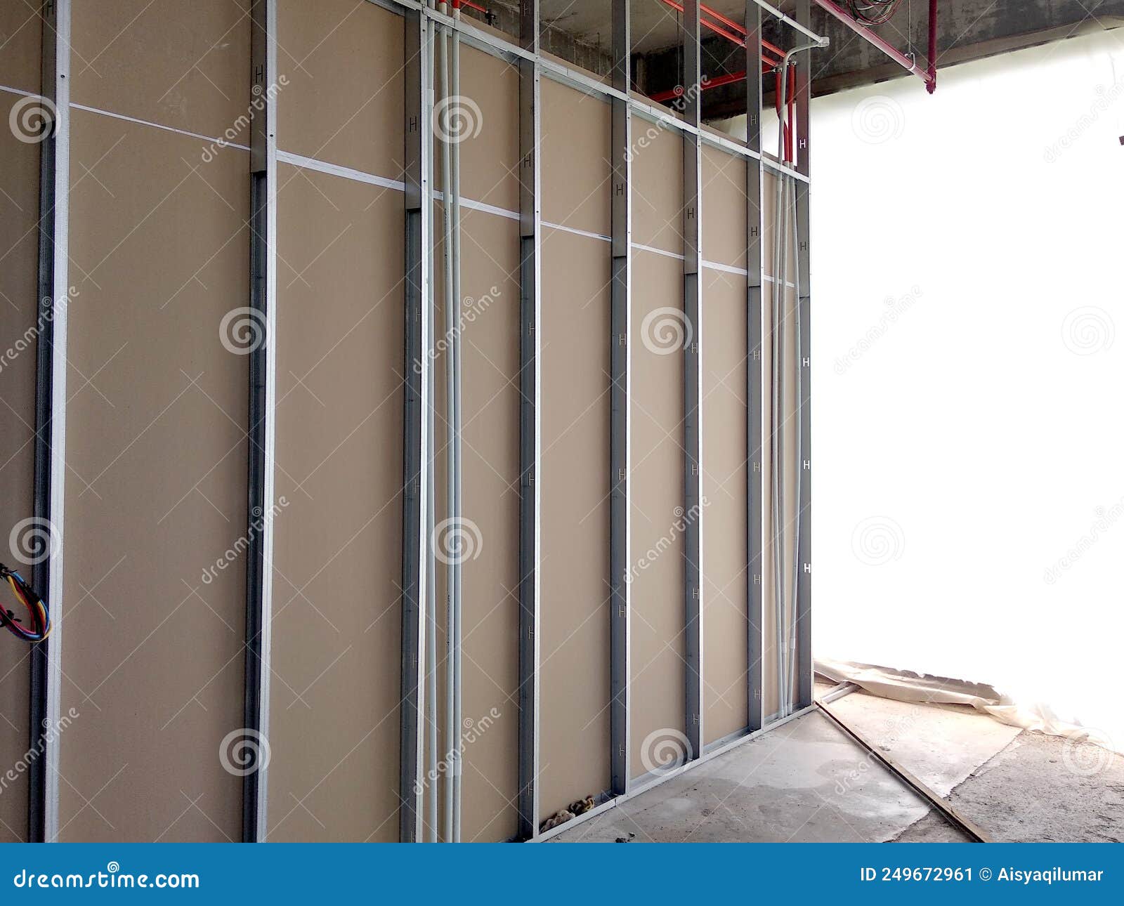 Drywall Installation Work in Progress by Construction Workers at the