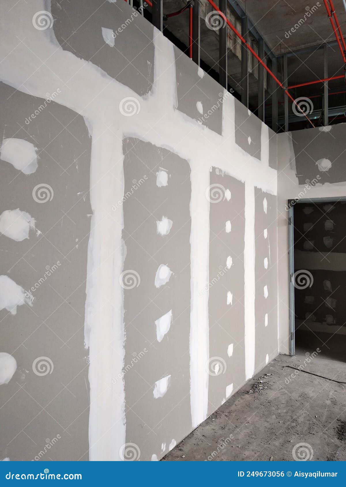 Drywall Installation Work in Progress by Construction Workers at the