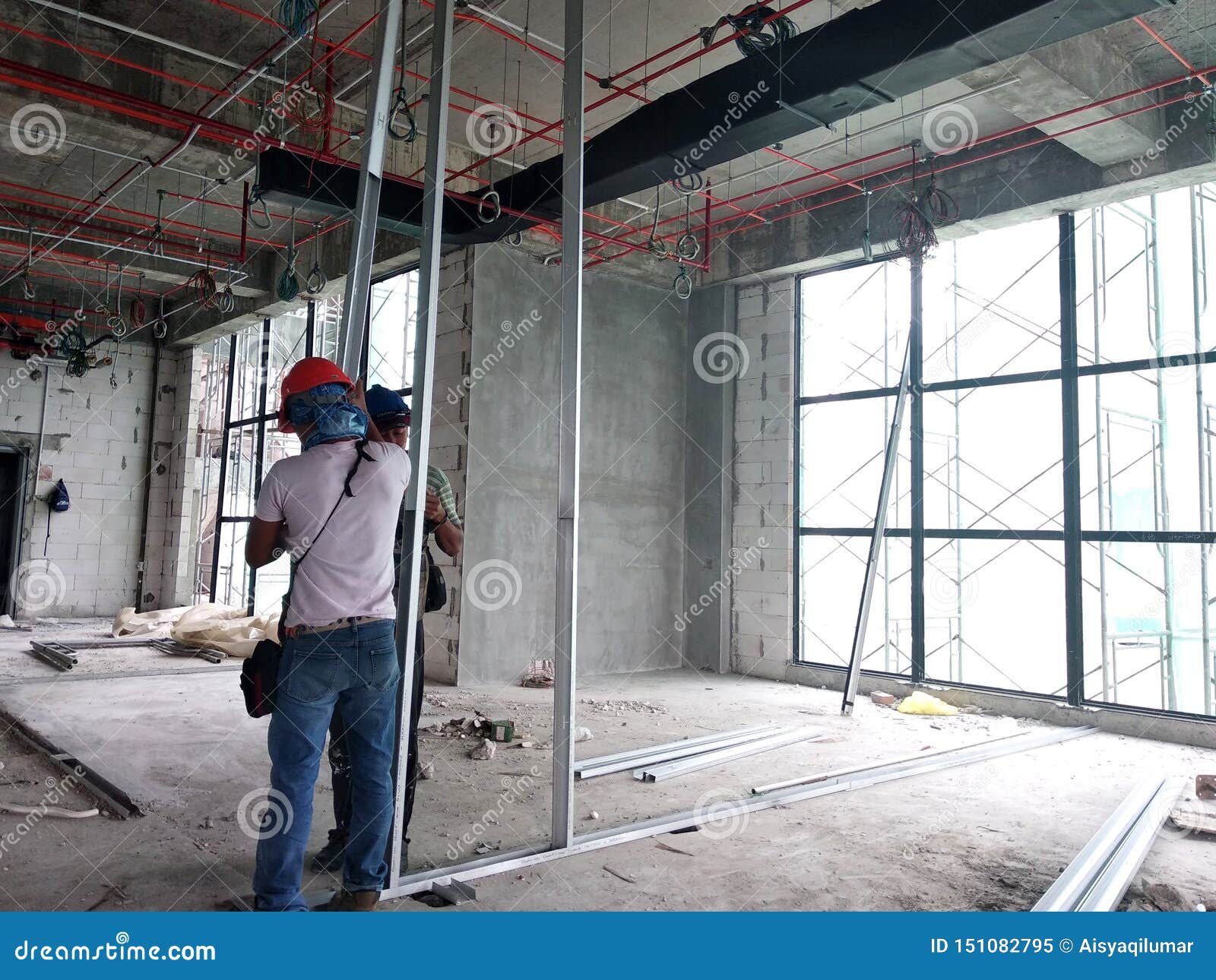 Drywall Installation Work in Progress by Construction Workers at the