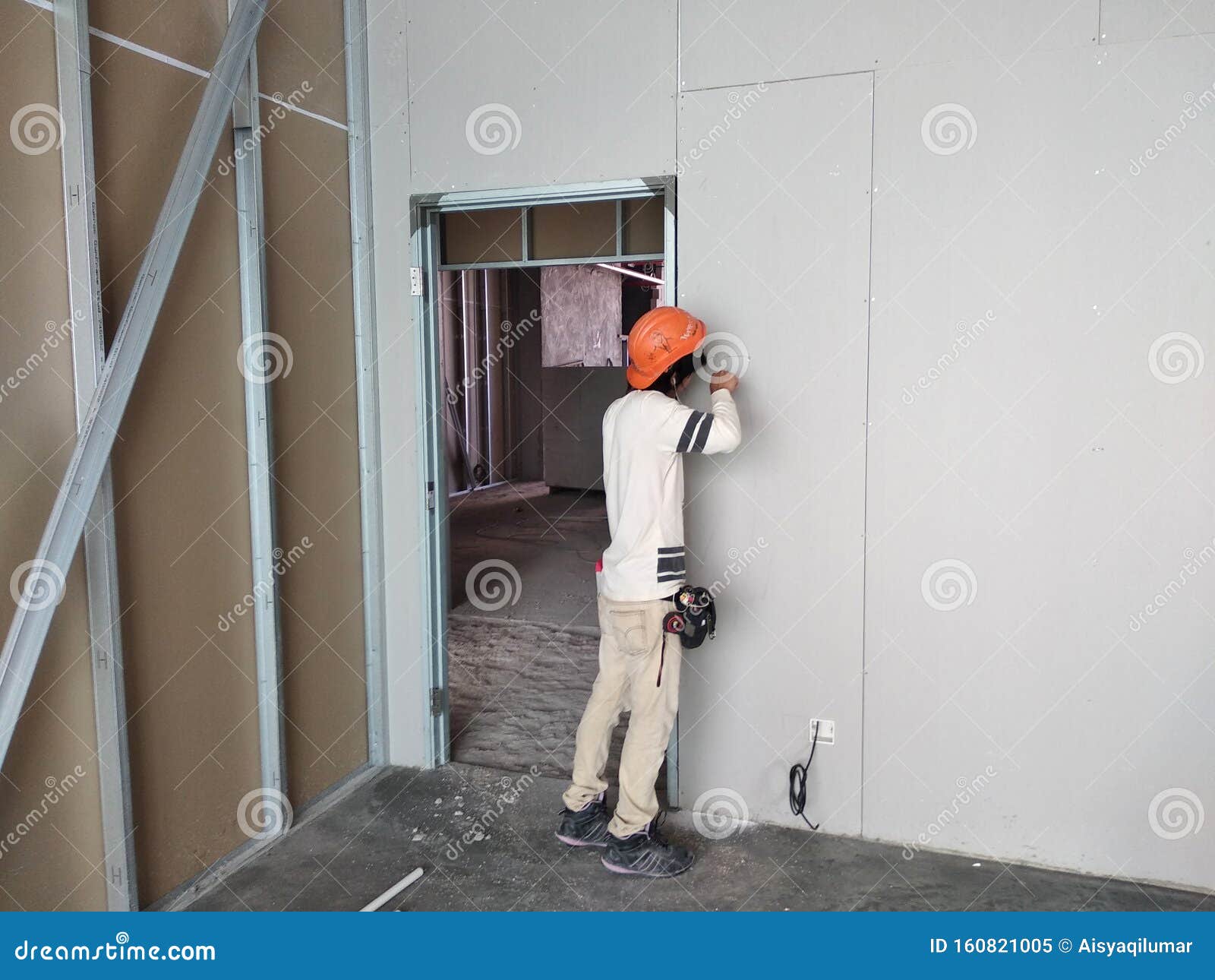 Drywall Installation Work in Progress by Construction Workers at the