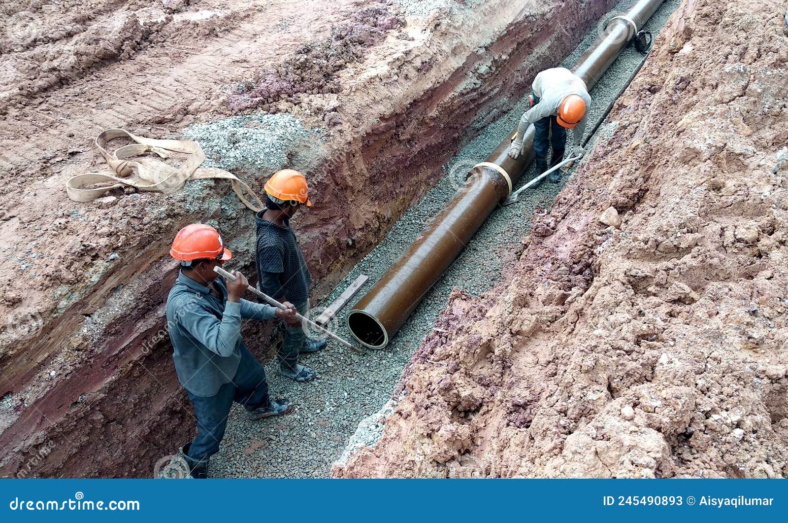 Underground Sewerage Pipe Installed by Construction Workers at the