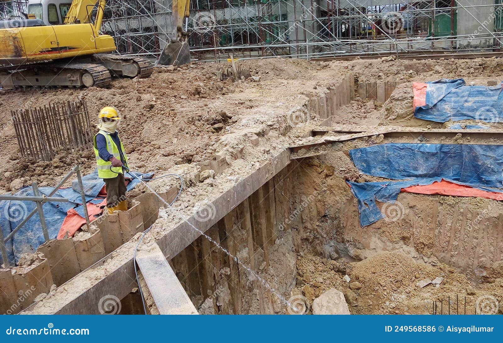 Construction Workers Spray the Anti-termite Chemical Treatment To the ...