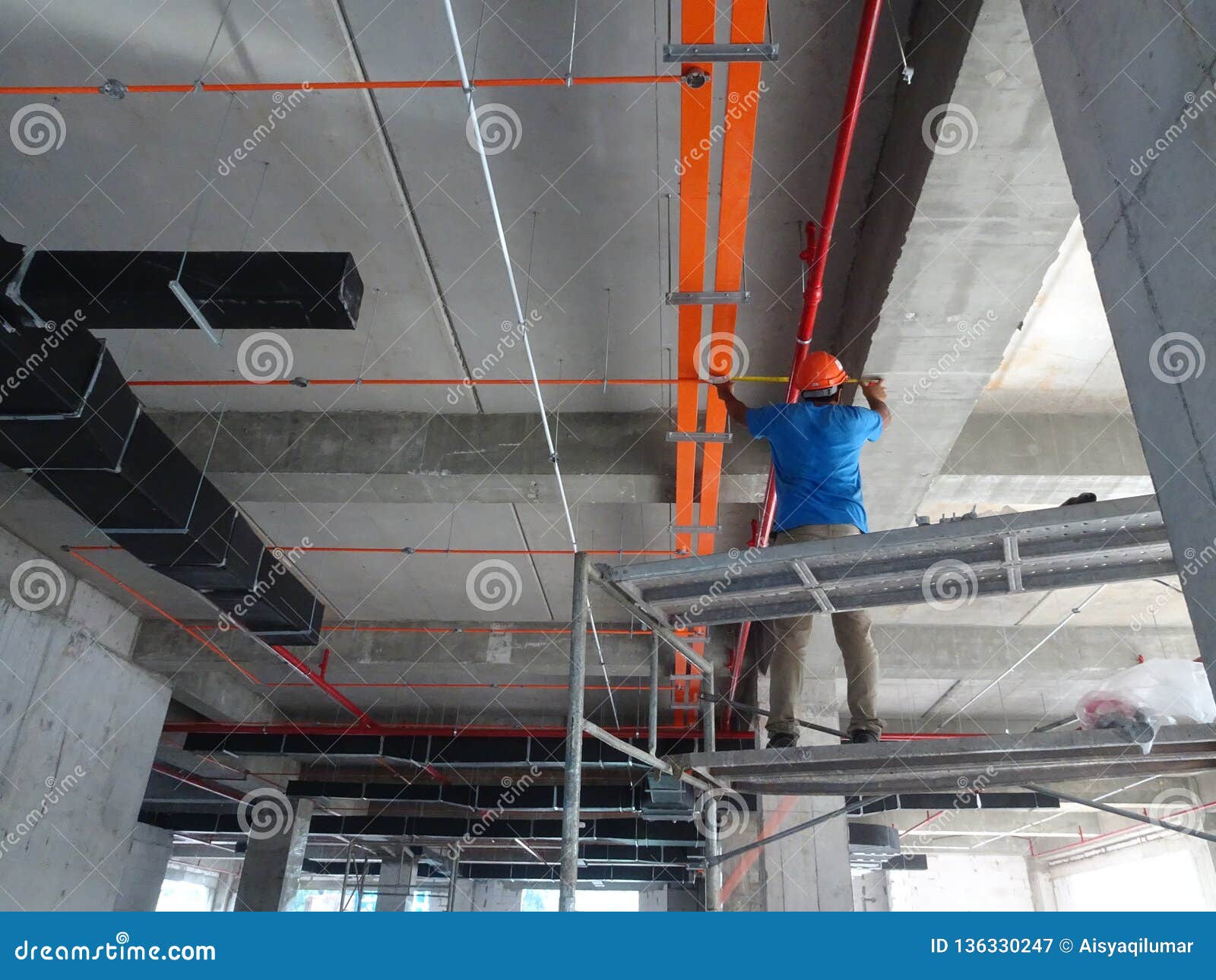 Construction Workers Installing Electrical Cable Tray On The