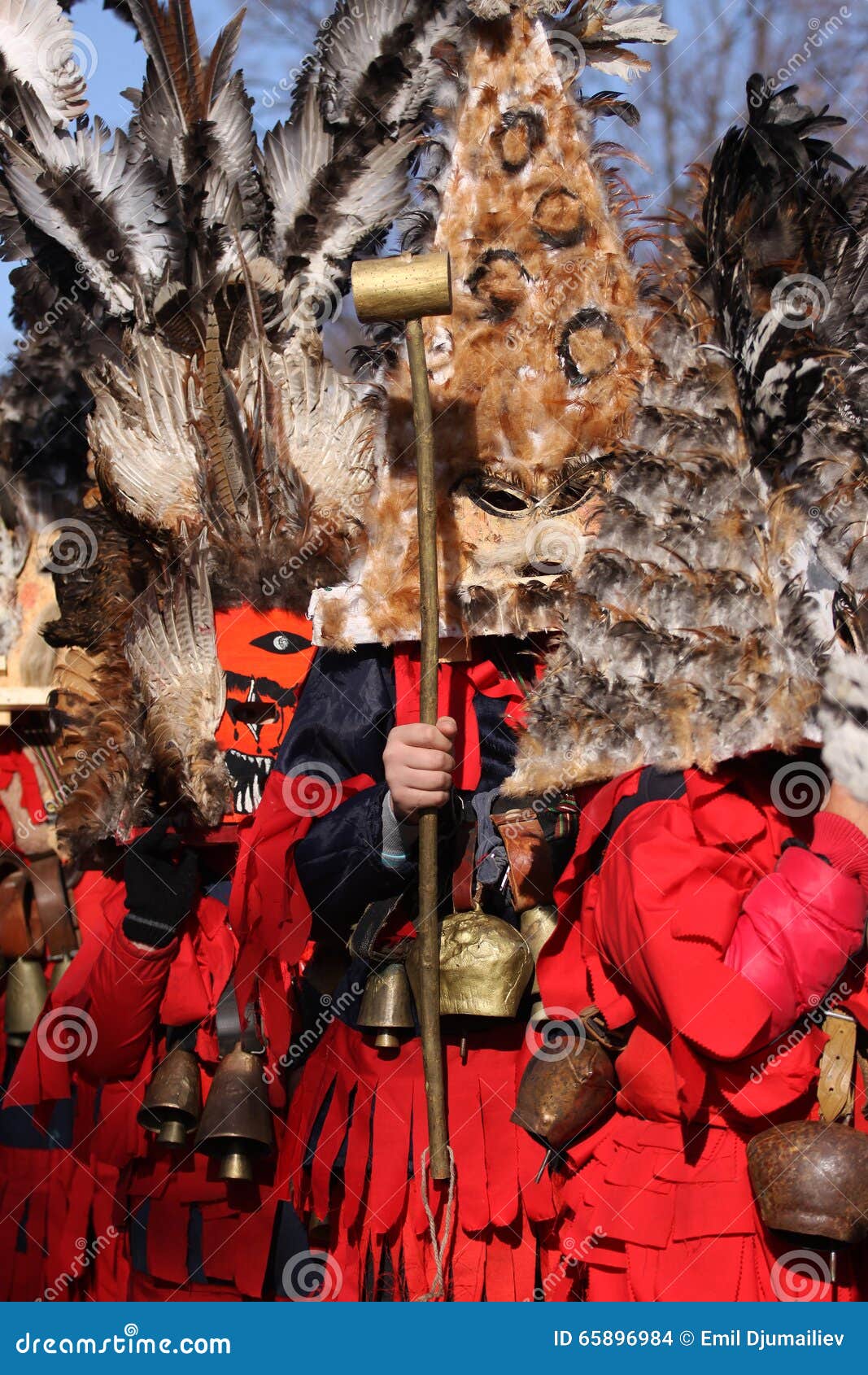 Kuker festival Bulgaria. Pernik, Bulgaria - January 30, 2016: Unidentified boy with traditional Kukeri costume are seen at the Festival of the Masquerade Games Surova in Pernik, Bulgaria. Surva takes place the third weekend of January and it s the biggest event of this type in Bulgaria. Photo taken on: January 30th, 2016