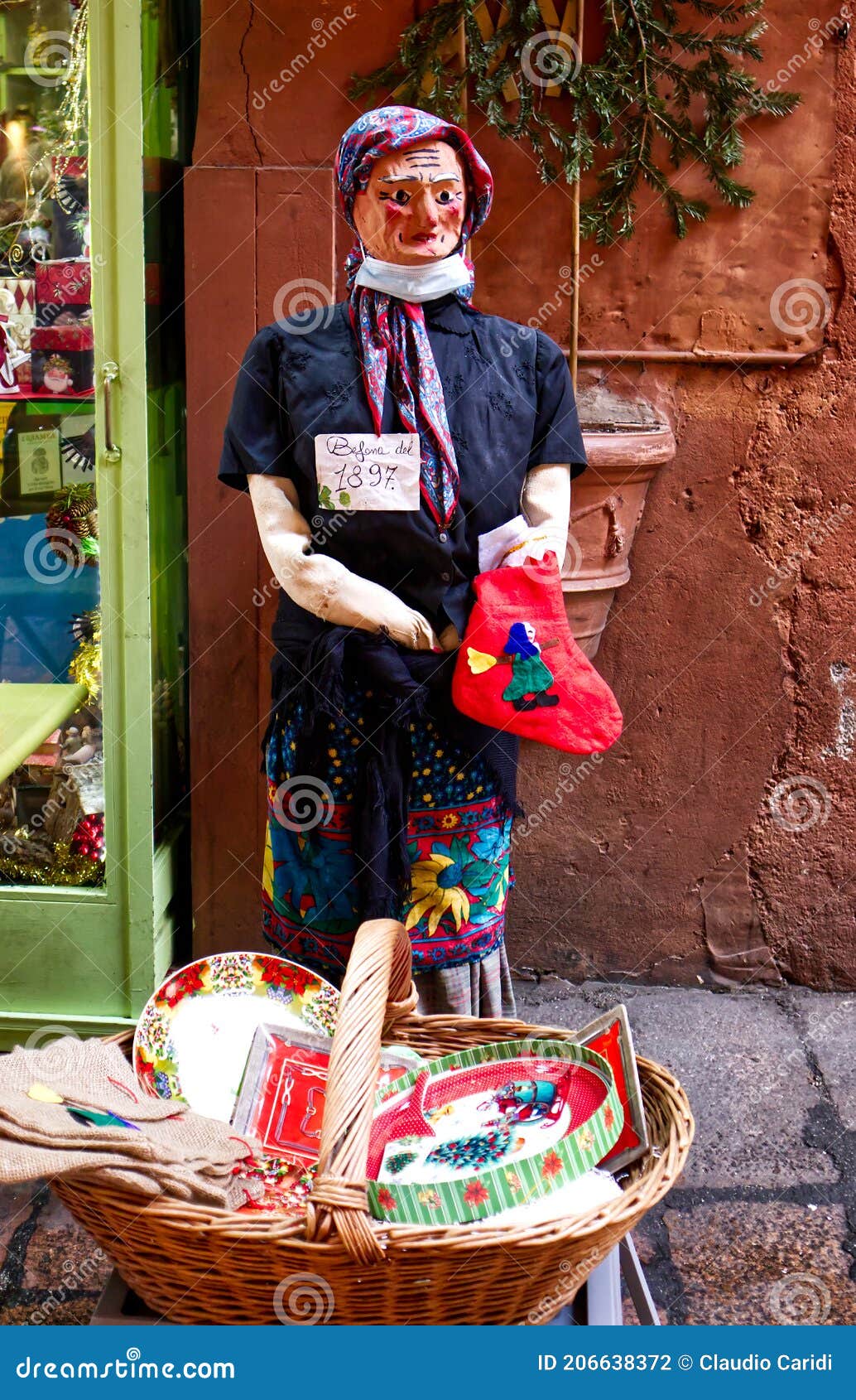 Bologna, Italy, January 2022 The Befana with a witch broom on red  background. Traditional witch costume for Italian Epiphany day. 5203299  Stock Photo at Vecteezy