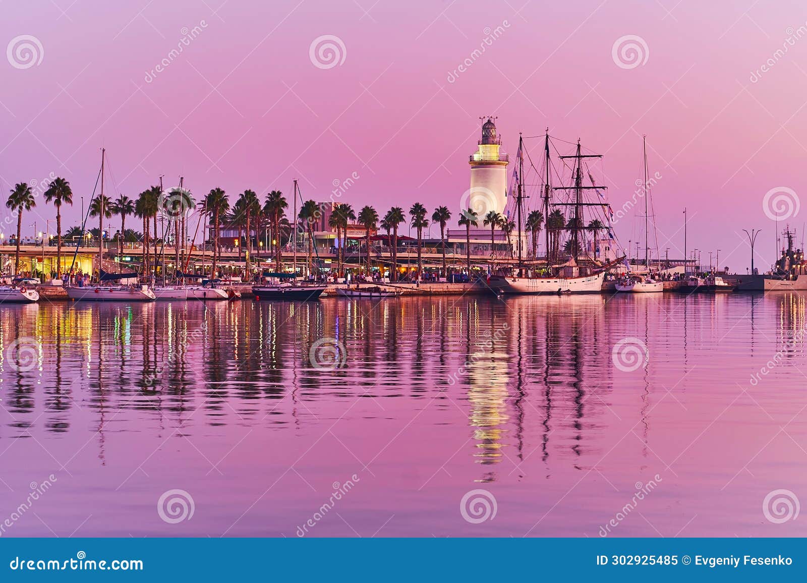 la farola lighthouse on twilight, malaga port, spain
