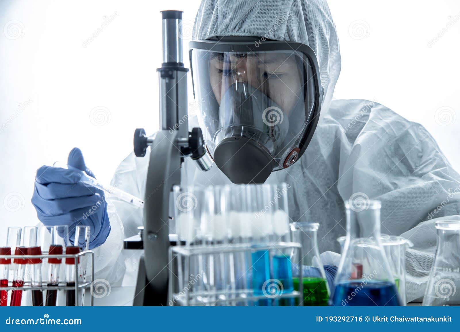 Scientist Analyzing A Blood Sample In Test Tube At