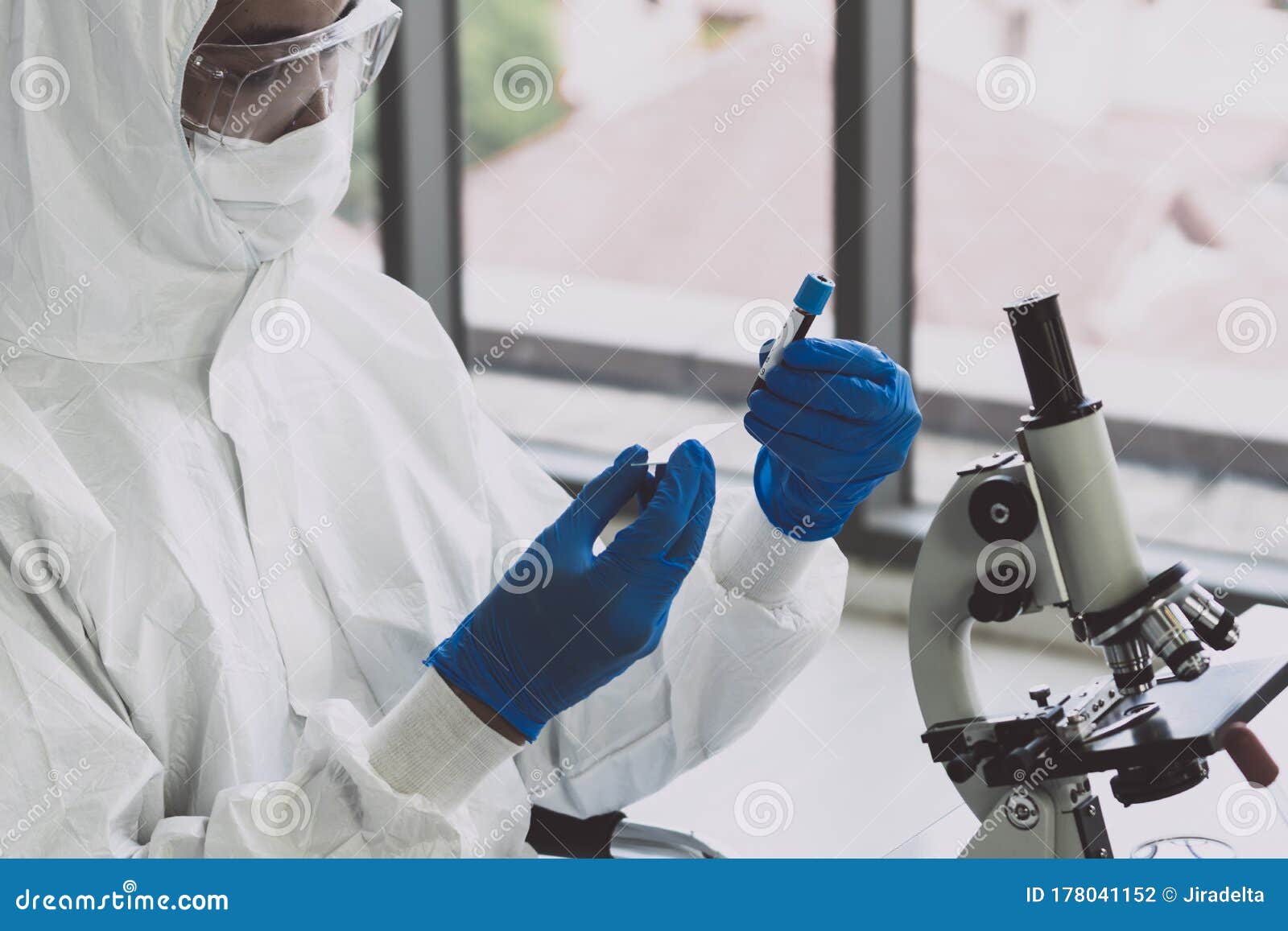 Lab Technician in Personal Protective Equipment PPE Suit Vaccines