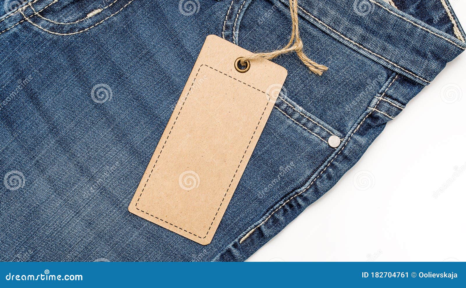 Label Price Tag Mockup on Blue Jeans from Recycled Paper. Stock Image ...