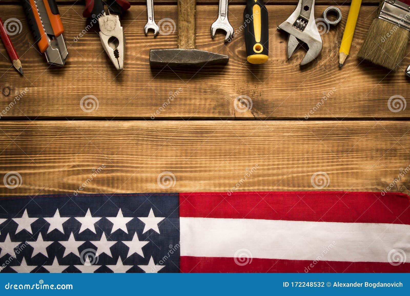 Labor Day. American Flag And Various Tools On A Wooden Background. The