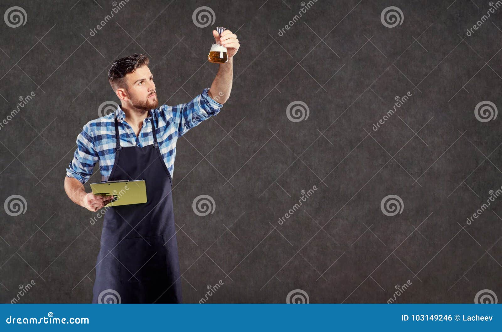 The Laboratory Assistant Brewer Winemaker Checks the Liquid in T Stock