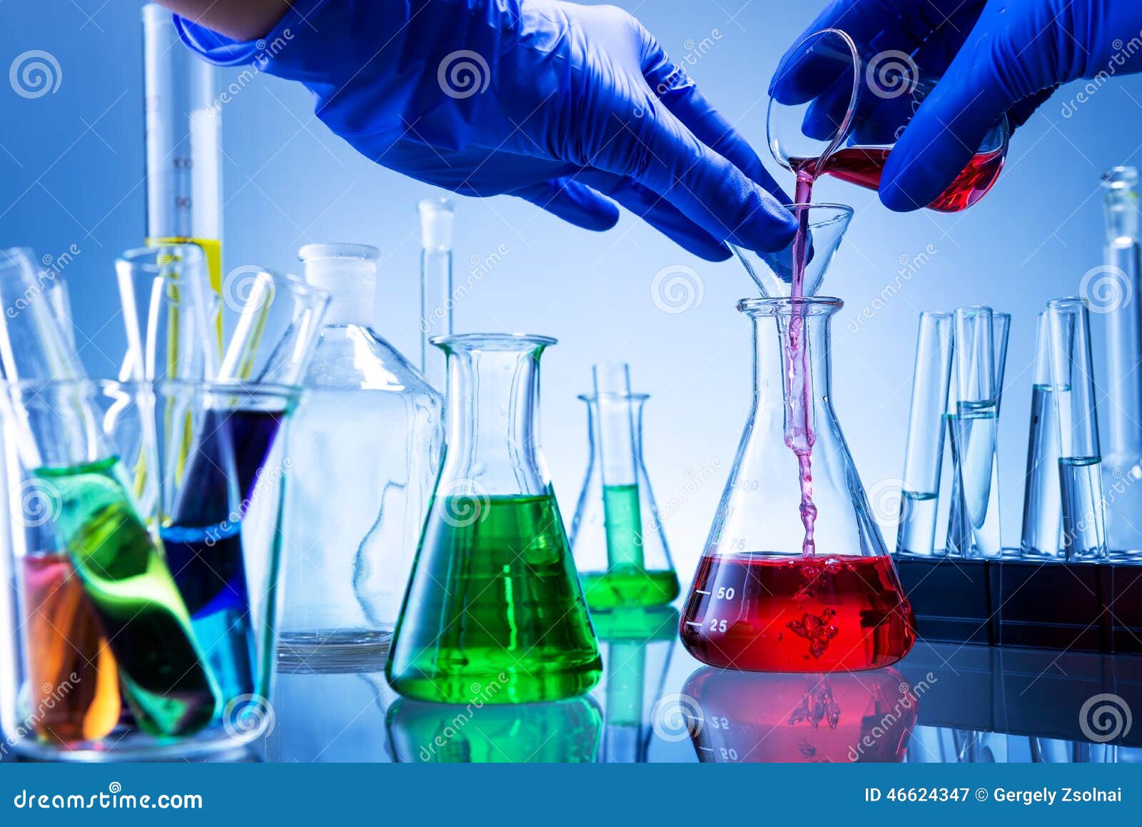 laboratory equipment, lots of glass filled with colorful liquids, hand poured