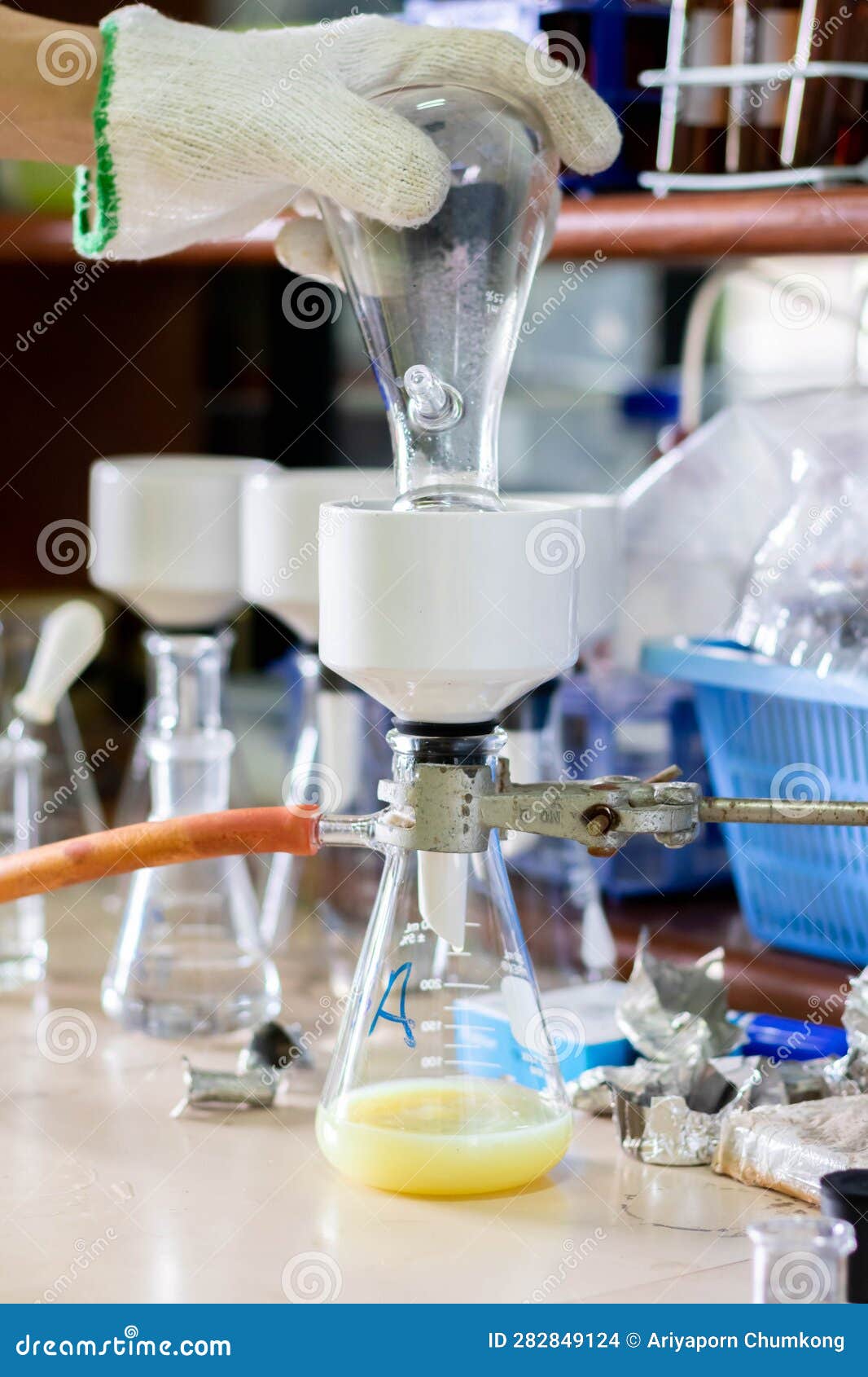 Laboratory Glassware with Green Liquid in a Science Research Laboratory