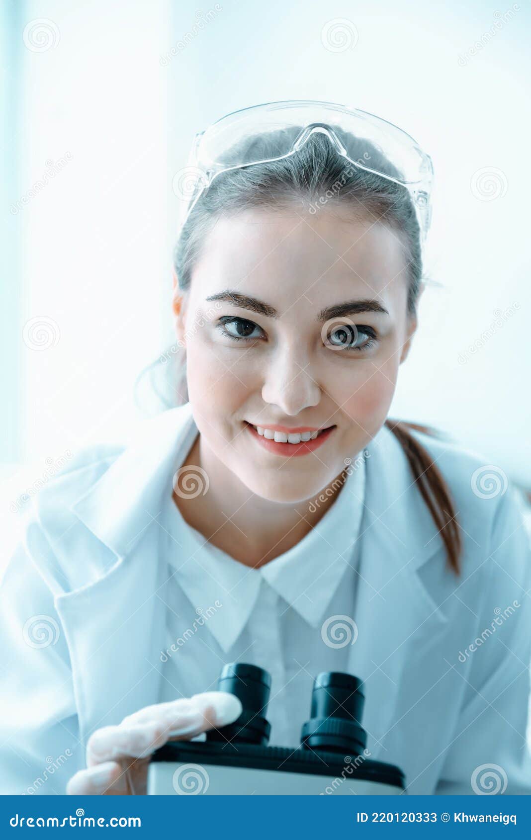 Laboratory Research Scientist Working with Microscope Testing Equipment