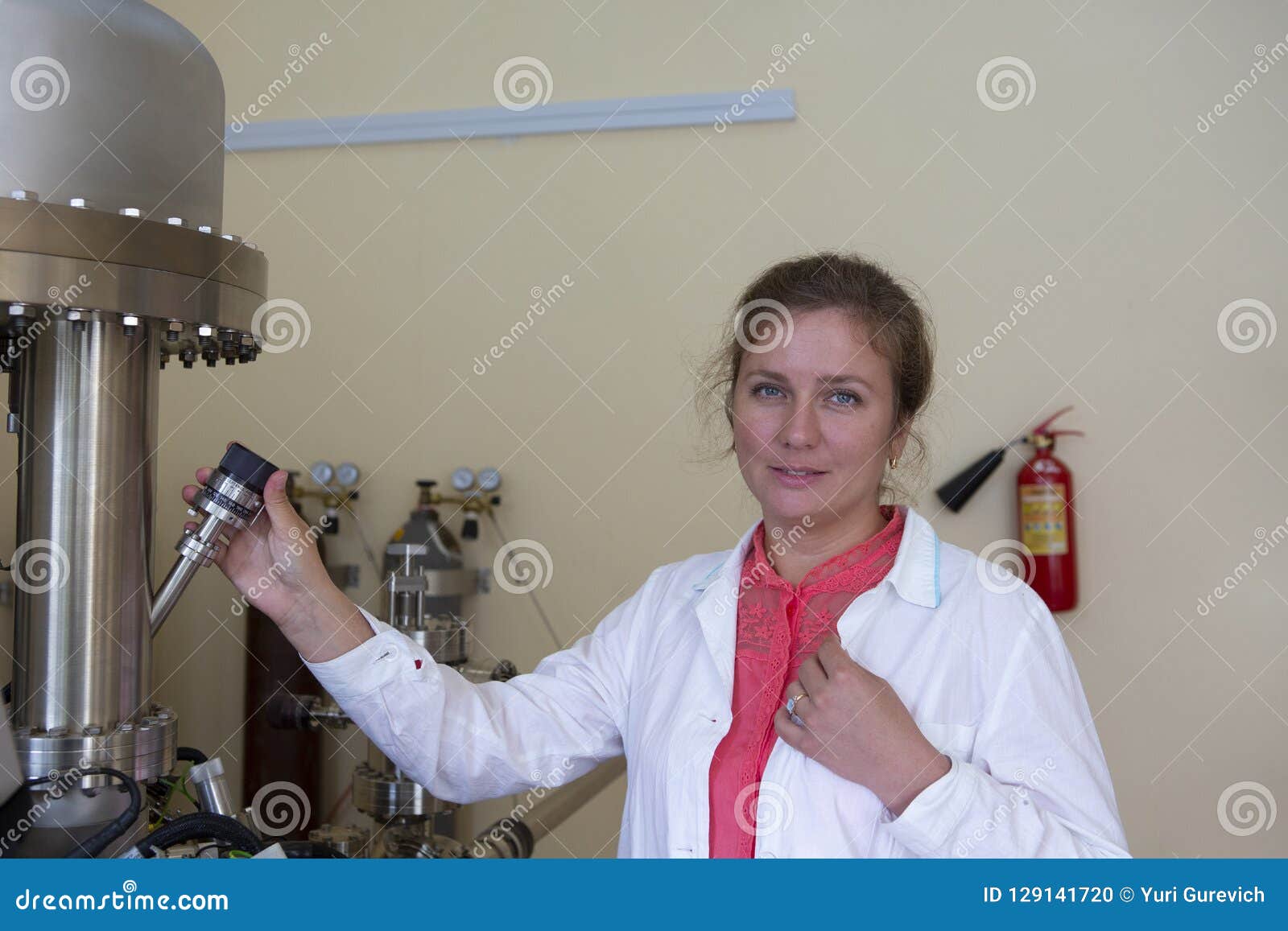 Laboratory Specialist Examines the Data Obtained on a Special Apparatus