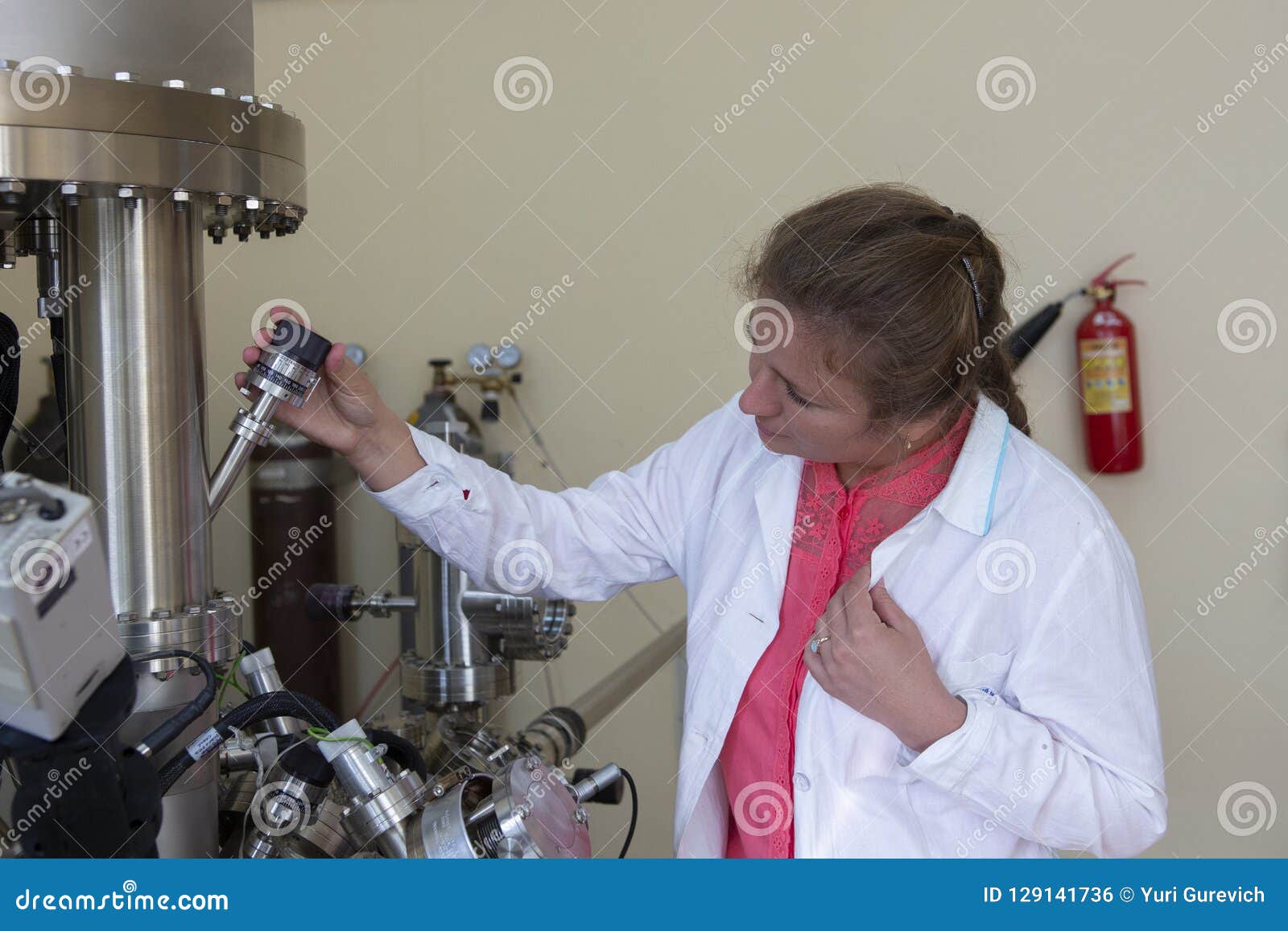 Laboratory Specialist Examines the Data Obtained on a Special Apparatus