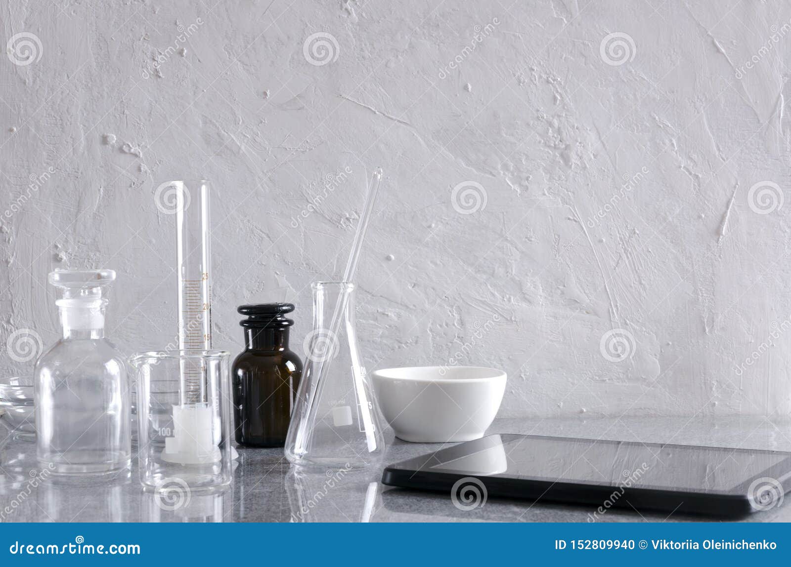 Many Different Medical Glassware for Laboratory Experimets, Tablet on