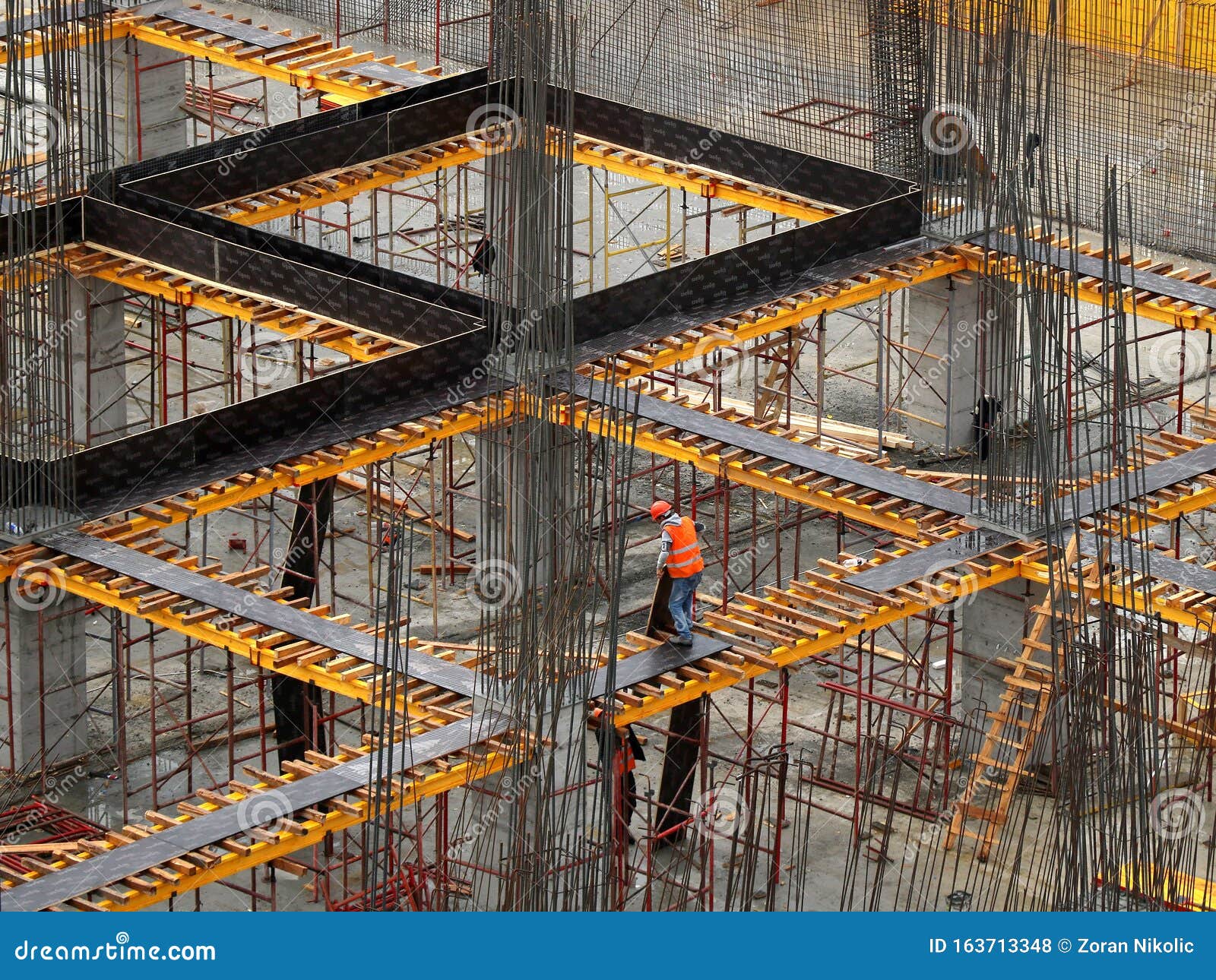 Laborers Working on Modern Construction Site Stock Photo Image of