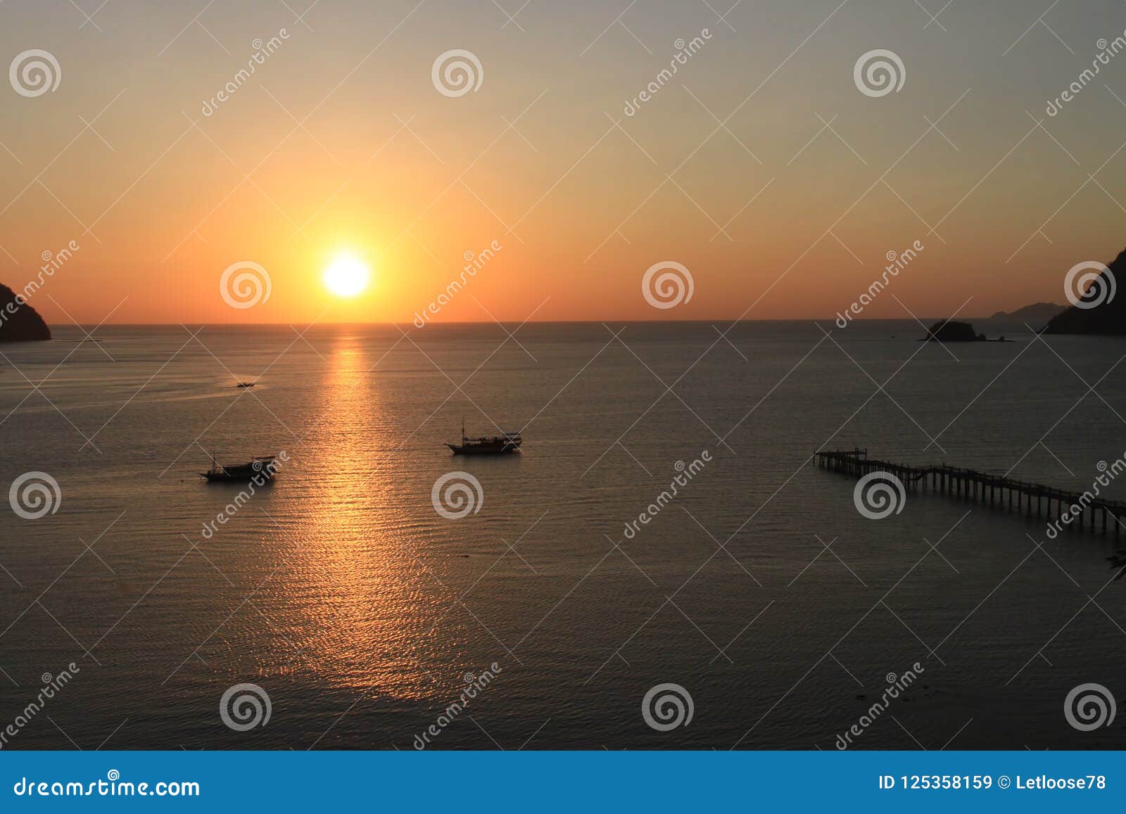 sunset on labuan bajo bay, nusa tenggara, flores island, indonesia