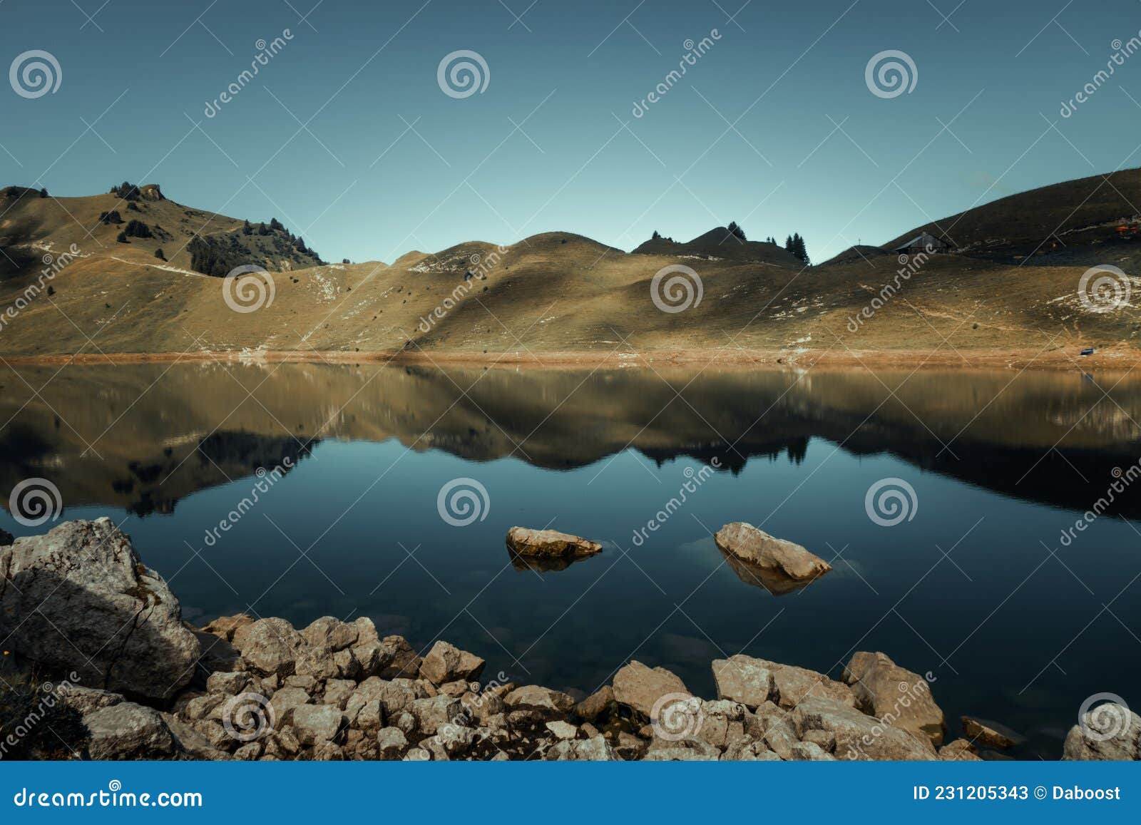 lac de lessy and mountain landscape at sunrise in the grand-bornand, france