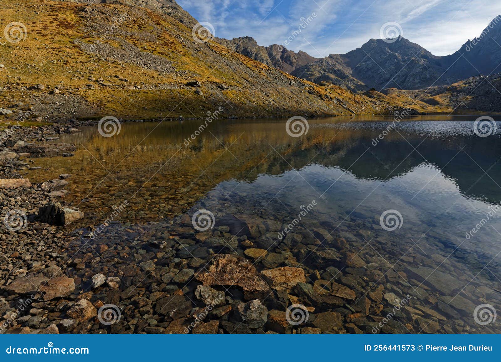 grand domenon mountain lake at the first rays of sun