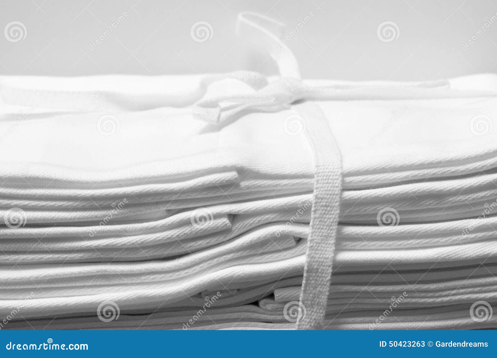 Laced Bundle of White Damask Cloth Napkins Stock Image - Image of ...