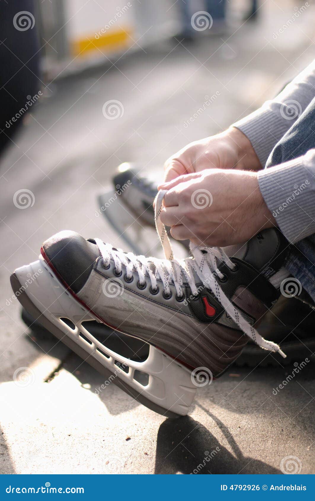 Lacing ice hockey skates stock photo. Image of hockey 4792926
