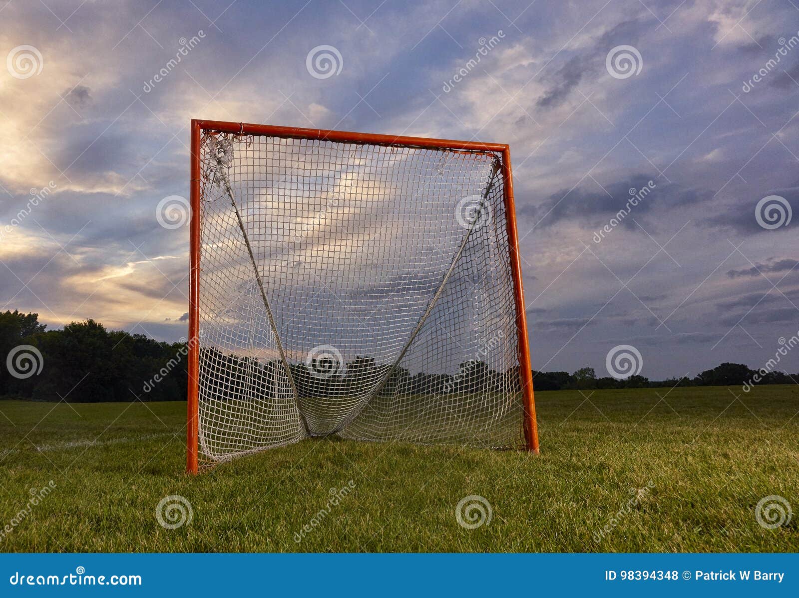 lacrosse goal with sunset