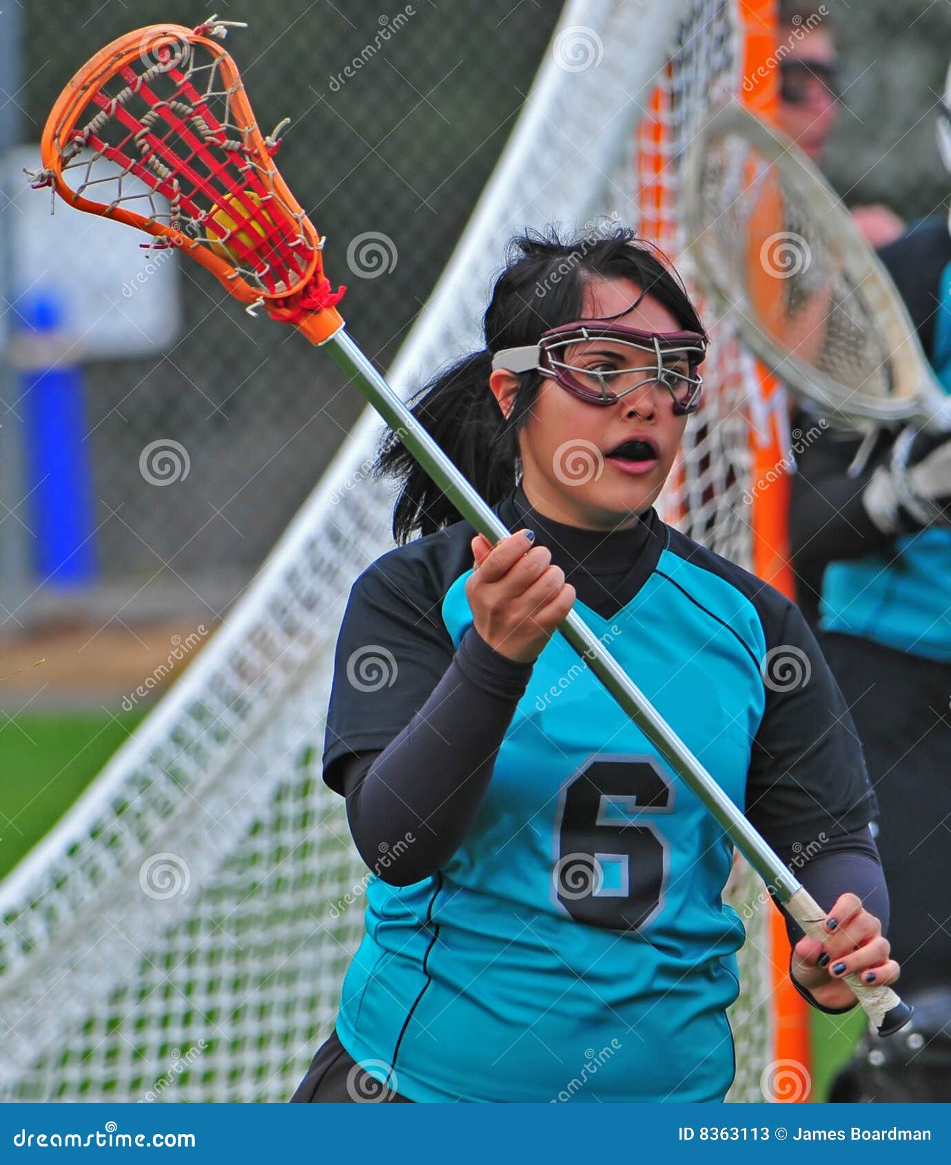 Lacrosse player on the run stock image. Image of womens 8363113