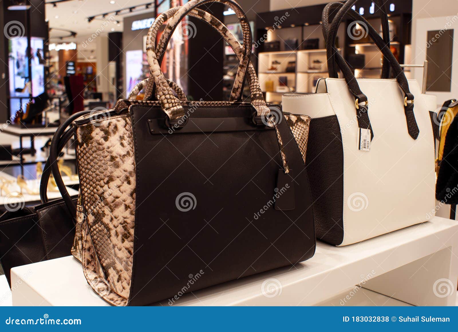 2 Ladies Bags on a counter stock photo. Image of purses - 183032838