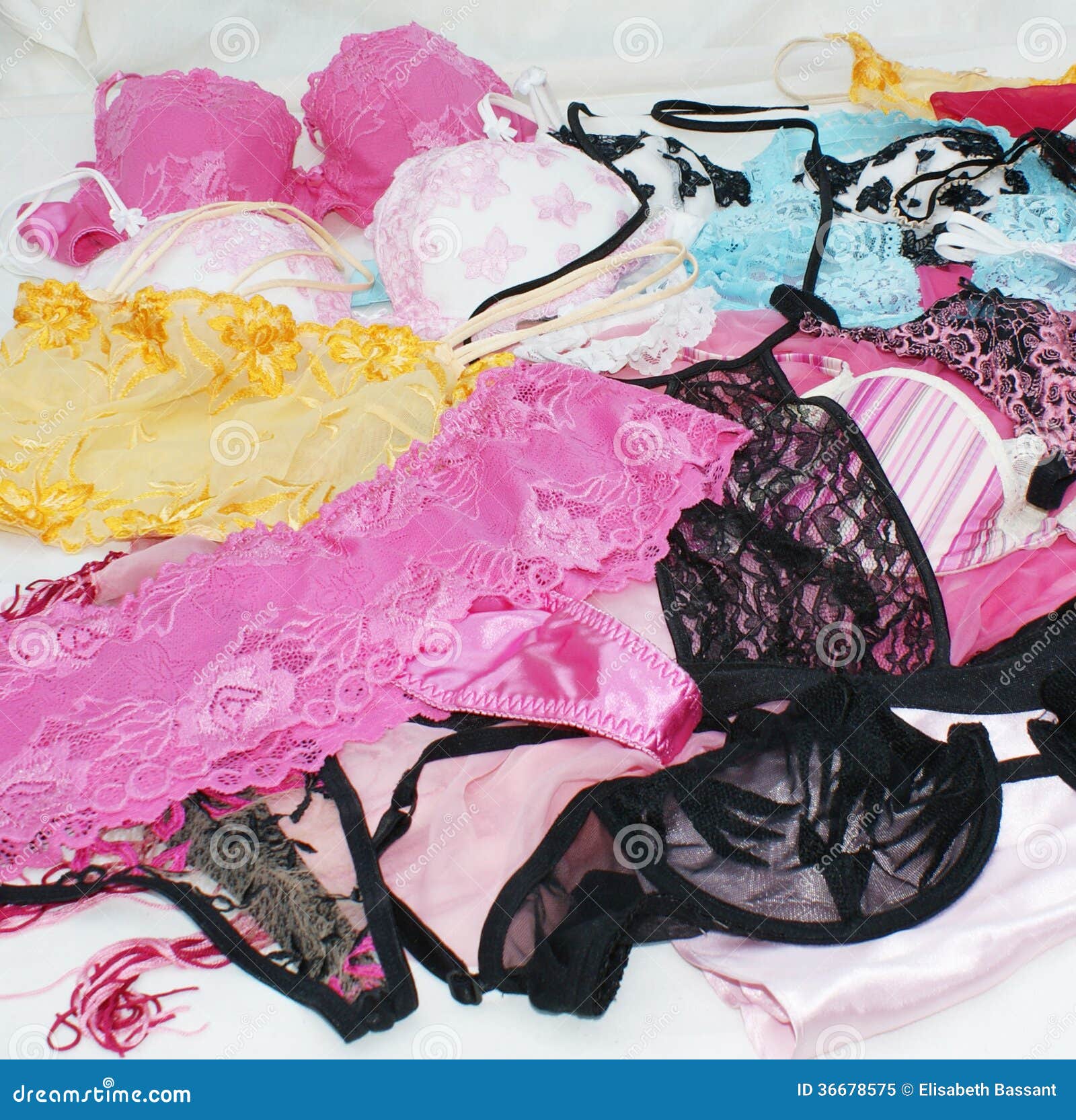 Many different beautiful women's underwear. Heap of Many multicolored bra  and Different sizes of underwear at lingerie shop department store. Big sale  special offer. Super Sale, End of season special. Stock Photo