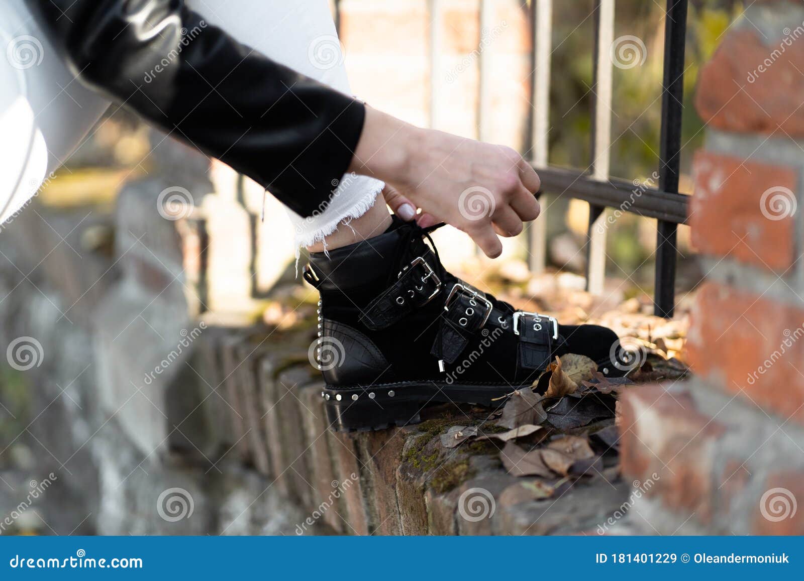 Ladies Tying Shoe Laces of Fashion Leather Shoes . Boots for a Modern ...