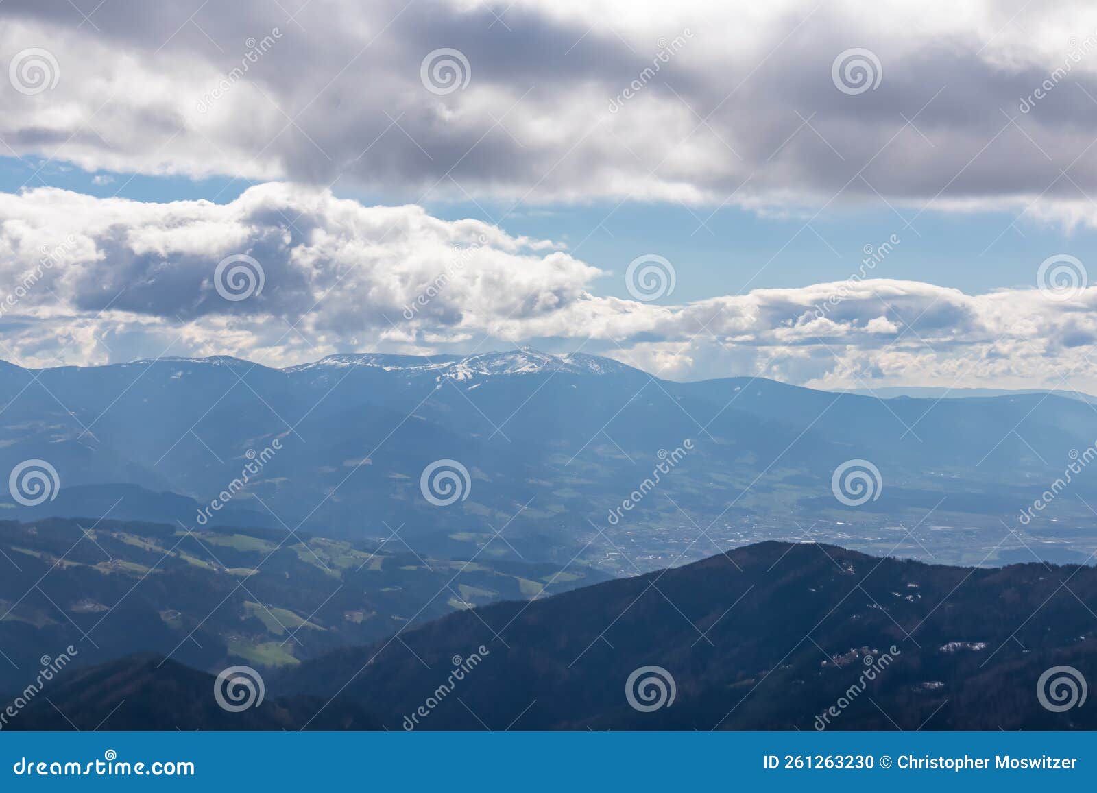 ladinger spitz - panoramic view on snowcapped mountain peak speikkogel on koralpe seen from gertrusk on way to ladinger spitz