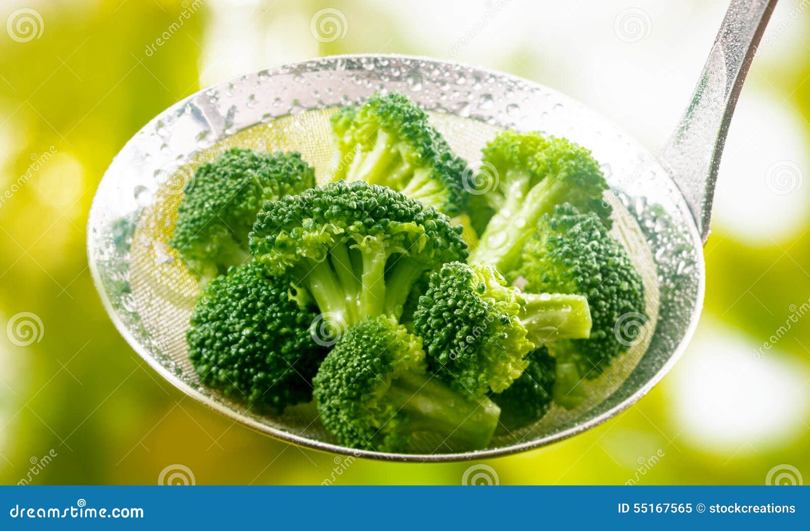 ladle full of steamed fresh young broccoli florets