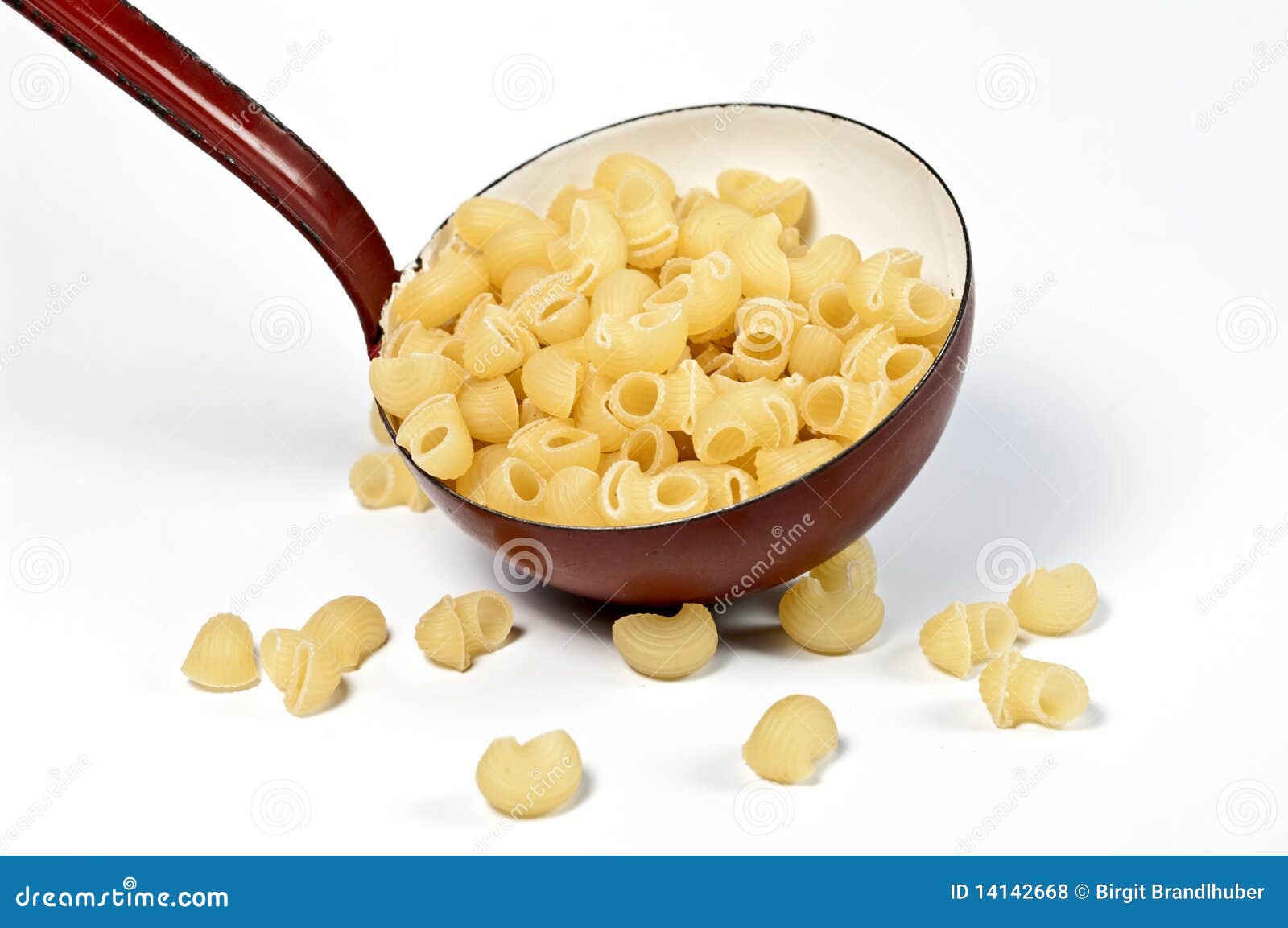 A ladle and pasta stock photo. Image of metal, pasta 14142668