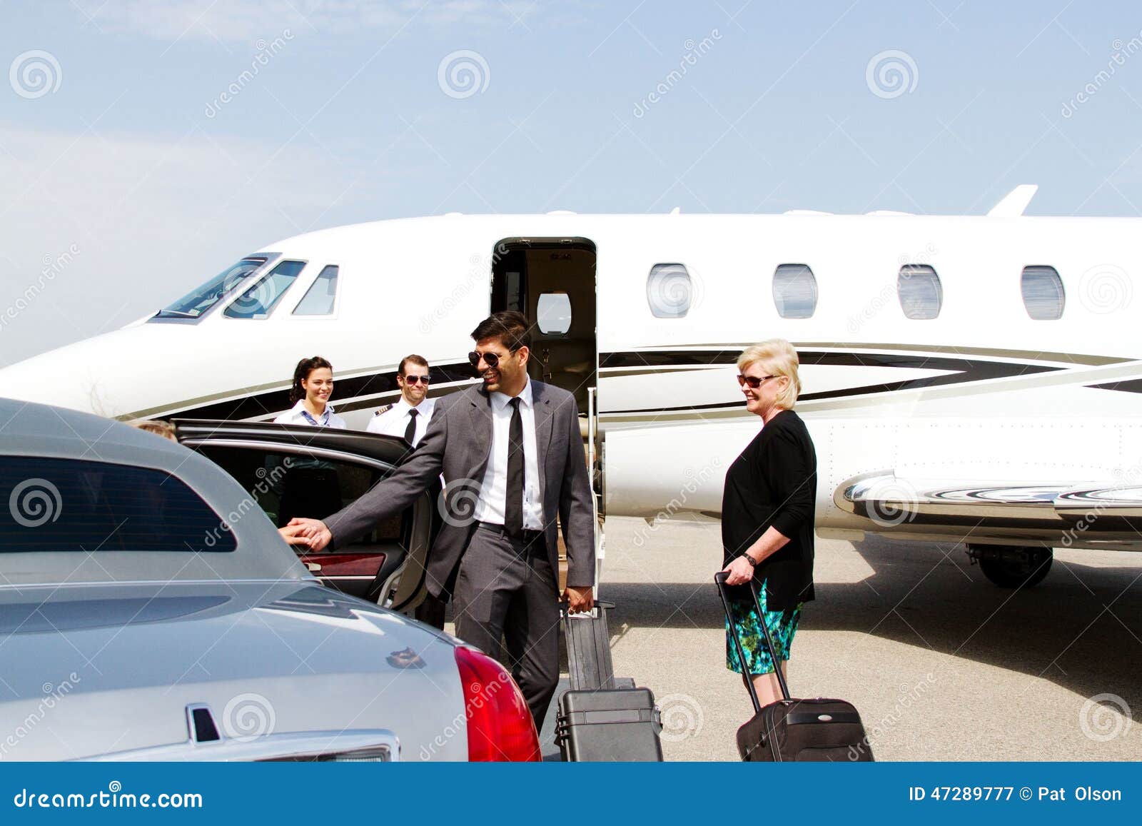 lady being assisted by chauffeur