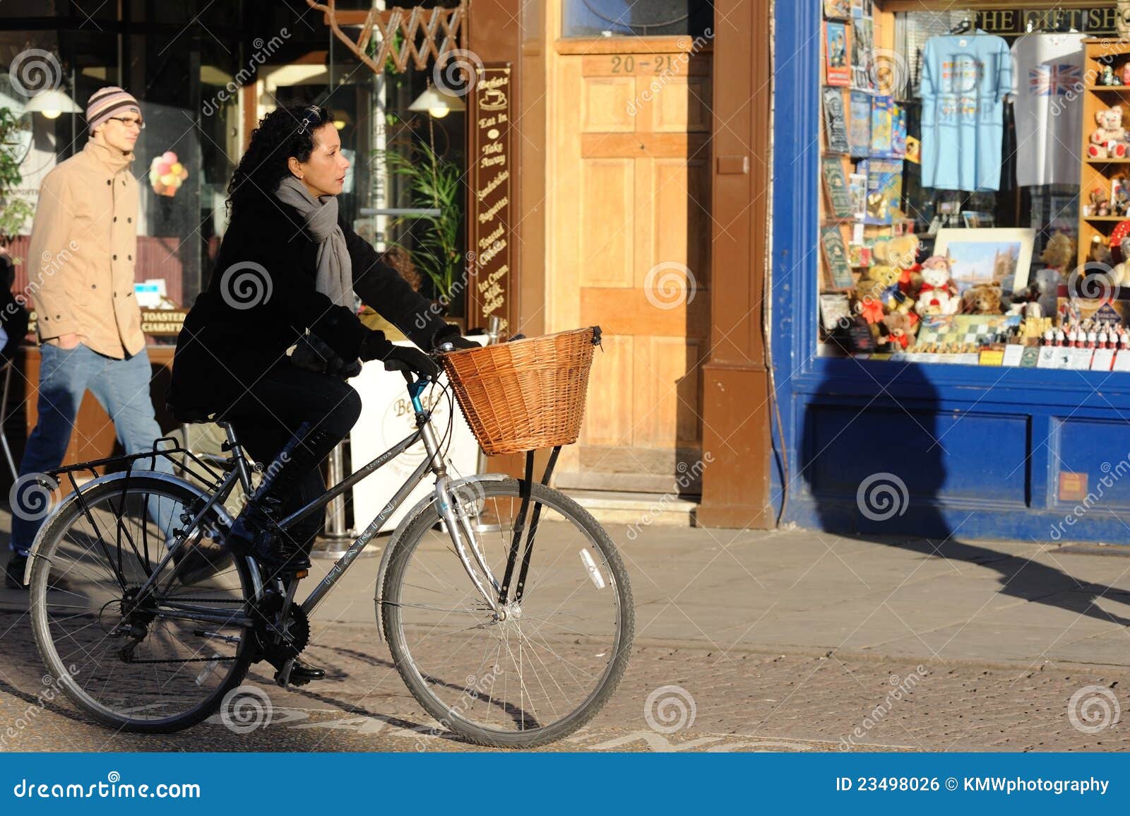 Lady on bike in Cambridge editorial photo. Image of city 23498026