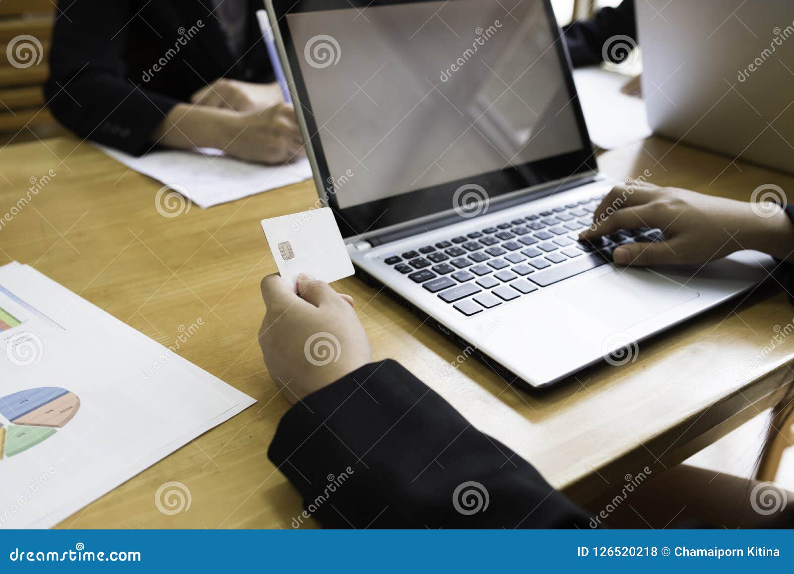 Lady Co Worker Using Laptop And Hold Card In Hand In Work Area