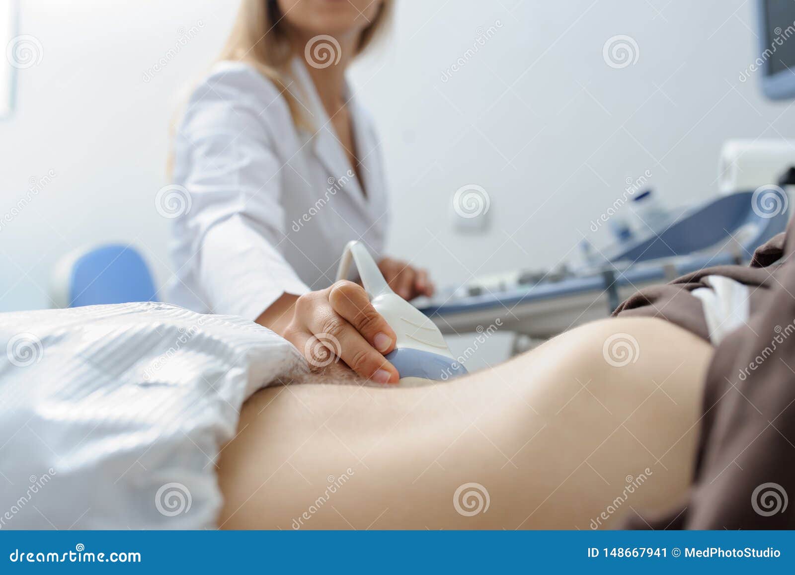 doctor  examination a man at abdomen  usg