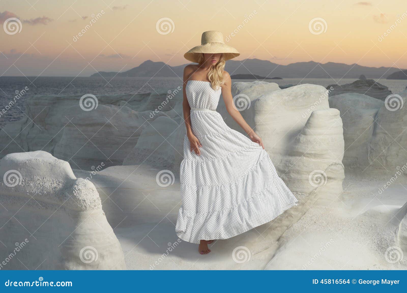 lady in hat in an unusual landscape